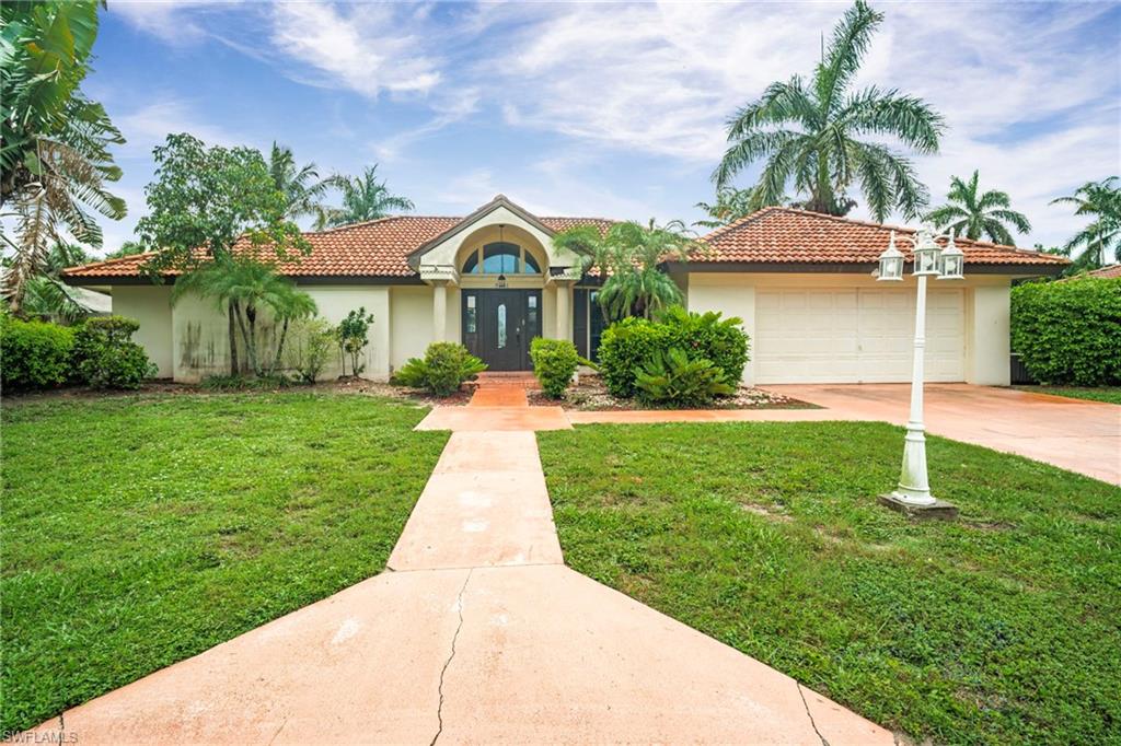 Welcome to this spacious and inviting Fort Myers pool home situated on an oversized .31-acre fenced lot with a beautifully landscaped tropical backyard oasis. Offering 3 bedrooms, a den/home office, 2.5 bathrooms, and multiple living areas, this property provides plenty of room for both everyday living and entertaining.

The thoughtfully designed floor plan features a generous kitchen that opens to the family room, creating the perfect gathering space, while a separate living room offers additional flexibility for relaxing or hosting guests. The private den/office is ideal for working from home, hobbies, or additional guest accommodations.

The spacious primary suite serves as a true retreat, featuring dual walk-in closets with custom built-ins and an oversized en-suite bathroom complete with dual sinks, a sunken soaking tub, and a separate walk-in shower.

Step outside to enjoy Florida living at its finest. The fenced backyard showcases lush tropical landscaping, a sparkling inground pool with waterfall feature, and a large covered patio perfect for outdoor dining, entertaining, or simply relaxing year-round. Conveniently located near shopping, dining, schools, and all that Fort Myers has to offer, this home combines comfort, space, and an exceptional outdoor setting.

This home is being sold as is.