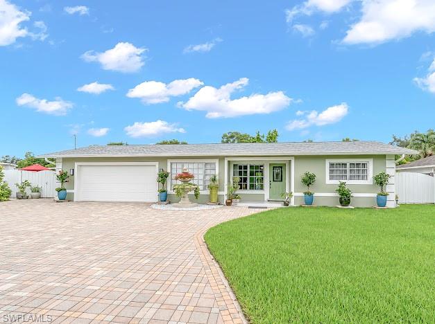 Beautifully remodeled LAKE VIEW Home, in the heart of Golden Gate City! This move-in-ready property features a spacious open floor plan a sparkling swimming pool, and a private backyard oasis with mature fruit trees, including avocado, mango, guava, and lemon. Mayor updates include new roof (2026) and gutters, water heater (2025)  offering added value to the new owner. One of the home's most remarkable features its rare extra-wide canal, creating the appearance of a tranquil lake and providing breathtaking water views with a peaceful, relaxing atmosphere rarely  found in the area. The outdoor living space is perfect for entertaining, gardening, or simply enjoying the beauty of Southwest Florida. Conveniently  located just minutes from Naples' world- renowned white -sand beaches, shopping centers, restaurants, schools,and Sun-N-Fun Lagoon water park. No HOA. This exceptional property has a MOTHER-IN-LAW APARTMENT THAN YOU CAN USE FOR EXTRA INCOME. Come and see this property.