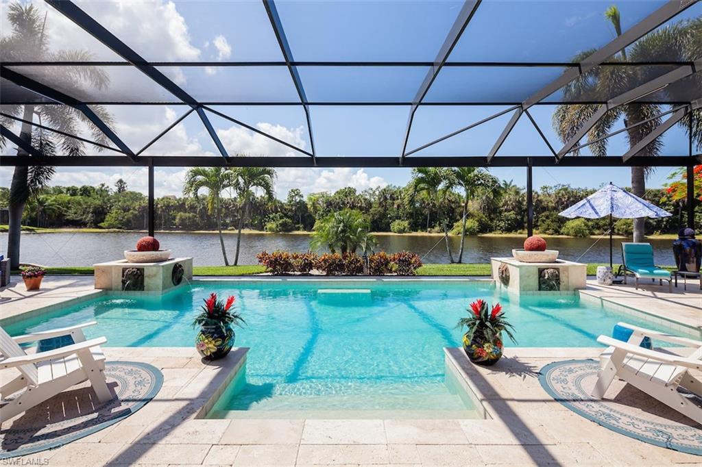 H9990   Among the finest homes ever offered in Audubon! Beautifully renovated home with spectacular Southern exposure & lakefront views offered in North Naples’ coveted “Audubon Golf & Country Club!” This stunning estate boasts a phenomenal open floor plan that lives fully on one floor with only a VIP private guest suite upstairs . Spacious entertainment deck is fully screened with a picture window enclosure, outdoor kitchen, ample living space, & heated pool with water feature. This light, bright & airy home features a NEW ROOF IN 2022, 
electric storm/hurricane screens, a generator & a new HWH 2018. Newly remodeled kitchen is finely appointed with quartz counters, custom cabinetry, wet bar & new high-end appliances in 2018. Delight in 4 bedrooms/den with marble & tile floors, a 2-car garage plus golf cart garage, & pocketing sliders in the great room for seamless indoor/outdoor living. High quality furnishings negotiable. Audubon is perfectly located 5-minutes from Mercato & world-class beaches, with gated/guarded entry, 18-hole championship Golf Course, tennis, pickleball, Bayside boardwalk, newly renovated clubhouse with dining & 2nd brand-new spectacular poolside club & café