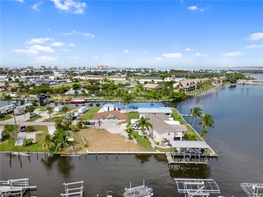Unique opportunity on San Carlos Island for an 80' wide waterfront lot moments to the Gulf of Mexico located on a quiet cul-de-sac! Oak St is mobile/manufactured home friendly but has a good mix of traditional homes as well. Most lots are 40 to 50 feet wide so to get a continuous 80 foot parcel is a rare find especially when adding in the NEW SEA WALL (2022). Build your custom dock to your specs & get ready to enjoy the waterways of SW Florida! Several new construction homes going up now & substantial sales of $1,050,000 in 2023 & another for $750,000 in July 2024 on the street. This is a great opportunity to get in on San Carlos Island! Investor friendly with potential for DUPLEX & WEEKLY RENTALS are permitted so would make an awesome rental property for a boater especially with potential of building a duplex. Have the best of both Fort Myers Beach & San Carlos Island without the "Island Traffic". With new marina being built nearby & potentially development now is the time to get in on San Carlos Island & be a part of something special!