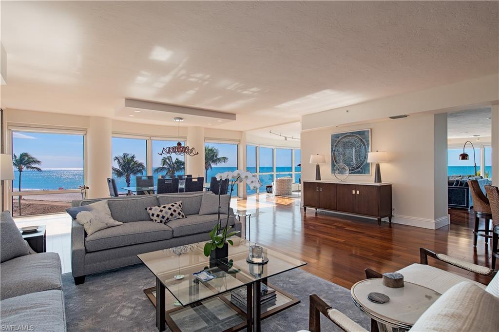 Enter in through your private elevator foyer and be immediately captivated by 180 degrees of blue gulf waters seen through the floor to ceiling glass. Ideally situated on the 3rd floor, this beach house style condominium offers an easy flowing and open floorplan which is all about the view from every room. Rich wood flooring throughout, custom cherry cabinets designed by de Giulio, modern track lighting and Golden Macauba granite all elevate this sophisticated design. The master bedroom is paradise found with access to a spacious covered balcony with retractable screens and a spa like bath with a stacked pebble shower and separate soaking tub. The handsome designated office is made for those who wish to relax and offers vistas down the beach. Inclusive of 3 additional guest suites, an entertaining bar, spacious laundry and storage room and private 2 car garage, Enclave #3 has it all and more.