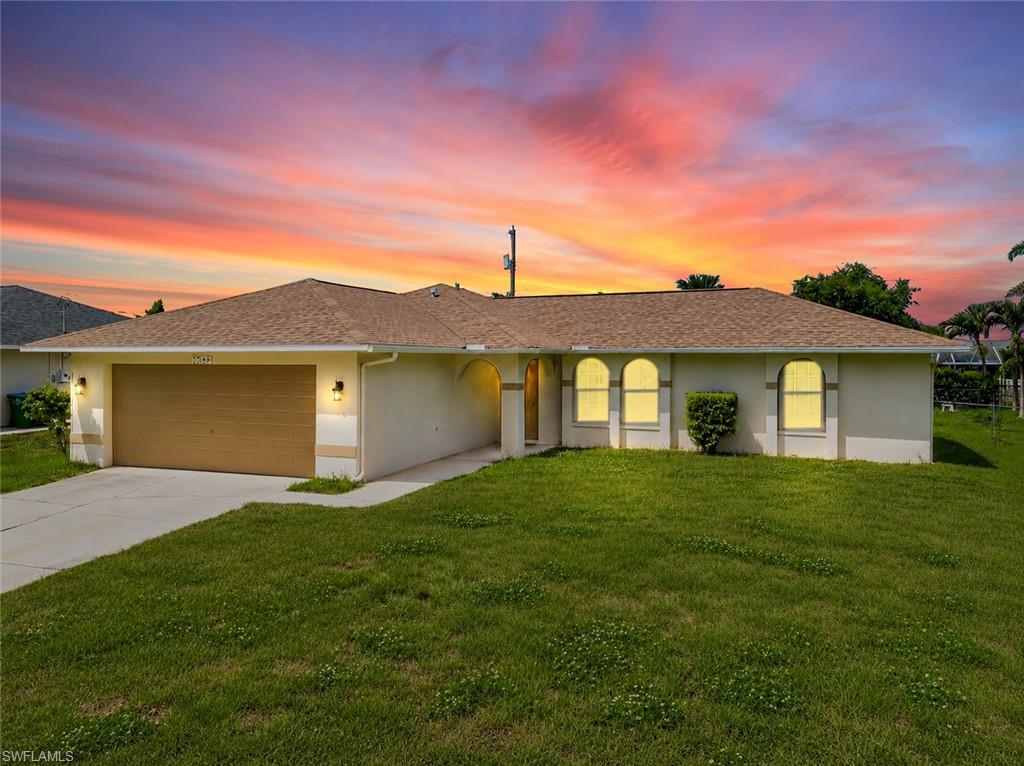 Welcome to one of the best values in Northeast Cape Coral. Thoughtfully designed with vaulted ceilings, abundant natural light, and an open floor plan, this move-in-ready home feels far larger than its size suggests.

This beautifully maintained 3-bedroom, 2-bath home combines modern updates, functional living spaces, and a huge fenced backyard, creating an opportunity that's hard to find at this price point. Whether you're a first-time homebuyer, seasonal resident, or simply looking for a low-maintenance Florida home, you'll appreciate the care and upgrades throughout.

The heart of the home is the stylishly updated kitchen featuring premium quartz countertops, shaker-style cabinetry, soft-close dovetail drawers and cabinets, a center island, pantry, and abundant storage. The open design makes entertaining easy while keeping the kitchen connected to the main living areas.

Large windows fill the home with natural light, while tile flooring throughout provides a clean, modern look and easy maintenance. The spacious primary suite features dual vanities and a walk-in closet, and all three bedrooms offer walk-in closets—a feature rarely found in homes at this price point. Modern lighting, four ceiling fans, an indoor laundry room, and a screened lanai add comfort and convenience to everyday living.

Step outside and discover one of the home's standout features—a huge fenced backyard with plenty of room for pets, a future pool, fruit trees, gardening, or simply enjoying the Florida lifestyle. The screened lanai creates the perfect spot for morning coffee or relaxing evenings outdoors.

Additional upgrades include a new roof in 2022, hurricane accordion shutters, epoxy-coated garage floor, sprinkler system, and a water treatment system recently serviced on June 1st. Flood insurance is not required, helping keep ownership costs lower.

Conveniently located near the rapidly growing Pine Island Road corridor, you'll enjoy easy access to Target, Publix, Lowe's, Aldi, Burlington, numerous restaurants, shopping, the VA Clinic, North Fort Myers, and Downtown Fort Myers.

Clean, updated, and truly move-in ready, this home offers an exceptional combination of value, comfort, and convenience. Schedule your private showing today and see why this home stands out from the competition.