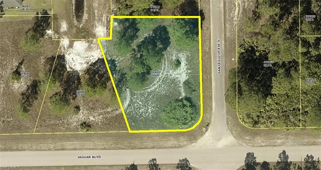 Really nice high and dry premium on fresh water canal oversize corner homesite (width 140' x 160' deep ... nearly 1/2 Acre) located in a very quiet area of LEHIGH ACRES. This property is mostly cleared ready to go with a few nice mature thinned pine trees with minimal low secondary growth/grasses with Southwestern on canal views at the rear of the home site with quick and easy access to Columbus Boulevard, State Road 82, shopping, restaurants, boating, golfing, schools, airport, medical & business services with highly desirable Southern views facing the Jaguar Boulevard. Build your dream or vacation home now and/or save this special area on-canal premium home-site for later. Don't miss this unique opportunity to purchase this premium homesite for only $9,995 with SELLER DIRECT FINANCING (Us) with $0 (ZERO) down, no credit check or income verification for ONLY $98.00 per month payment. Personal checks OK. Call today... you'll be so glad you did...