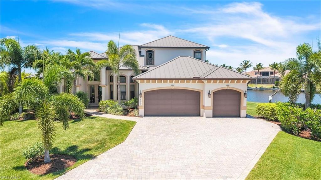 Rare direct Gulf access custom pool home on an oversized lot with an impressive 183 feet of water frontage, capturing breathtaking sunset views over the Spreader Canal and intersecting waterways. Built by Sinclair, this 5-bedroom, 4-bath residence delivers an open floor plan with soaring 8-foot interior doors, 10-foot sliding glass doors to the lanai, and impact-resistant windows and doors throughout. The metal roof and high-and-dry flood zone provide peace of mind — this home did not flood during Hurricane Ian.
The chef's kitchen features 42-inch custom wood cabinetry, a pantry, breakfast bar, casual dining area, and stainless appliances — all finished with granite countertops carried throughout the home. The spa-inspired primary suite offers dual walk-in closets, custom vanities, and a soaking tub. A formal dining room/den adds flexible living space, while tile flows through the main areas and plush carpet warms the bedrooms.
Step outside to the brick paver screened lanai and pool, where spectacular water views make every evening a private retreat. The 3-car garage and oversized lot complete a property built to last