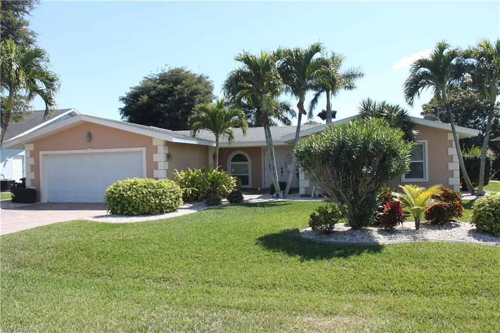 Serious boaters, take a look at this gem! 200 foot of wide open deep water canal. Just minutes to the open water! Don't let homes age fool you. 16K lb boat lift with large dock. When you are not boating, you can kick back and enjoy the recently renovated salt water pool. It has solar and electric heat. Dine in the shaded area of the screened lanai and swim in the sun! The home has impact windows and doors. Interior features, 2 master suites. One with large master with dual sinks, large walk in shower and plenty of storage. Second master features a fireplace, french doors to the pavered lanai, sitting area, bath with dual sinks and walk in shower. Great for the mother in law or a guest bedroom. Kitchen has white cabinets, corian tops, samsung appliances, breakfast bar and eating area with access to the lanai for easy serving. Entertain in the formal dining room. The living area is large with plenty of room for the entire family.
The third full bath is also the pool bath, just off of the kitchen. It has a pedestal sink and tub. This is a great home in a fantastic location. Just north of Cape Coral Parkway. Easy access to bridges, dining and all of the City's functions. See it today!