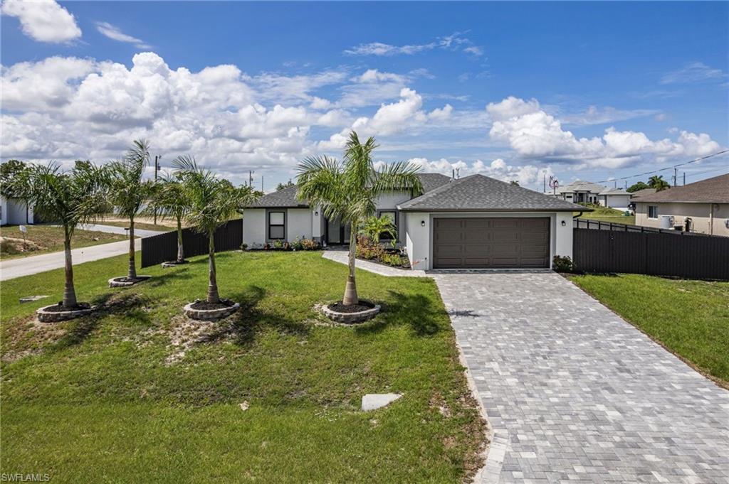 This stunning 2025-built 3-bedroom, 3-bathroom home sits on a premium corner lot and offers resort-style living. The open-concept Great Room seamlessly connects to the gourmet kitchen, featuring white shaker cabinetry to the ceiling, quartz countertops, a glass tile backsplash, and a massive island with a breakfast bar. Step outside to your tropical backyard paradise, complete with a sparkling rectangular pool, an expansive paver deck, and a covered lanai perfect for entertaining. Additional features include an oversized 2-car garage, indoor laundry with utility sink, and full privacy fencing. This one won't last!
