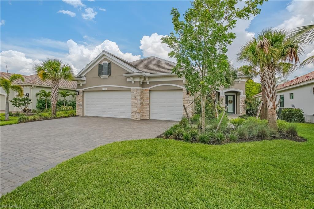 Exquisite Pool home in Daniels place! Not a detail missed in this model like 3br plus den home, with gorgeous heated Pool built in 2020 by Neal Communities. You'll appreciate the security of full home impact windows and doors plus automatic full house generator. This one is loaded with custom upgrades and features! Built in 2020, elegant 10ft tray ceilings, GE Monogram series appliances, 8ft Barn doors, Wine/Coffee bar nook with cooler, white plantation shutters throughout, Quartz counters, gas range, custom ceiling fans, beautiful tile backsplash, pull out drawers, island with dishwasher, pre-plumbed for outdoor kitchen, paver lanai, walkways and driveway.  Relax year round by the heated pool complete with sun-shelf, fountains and serene wooded views.  Plenty of storage too with a full 3 car garage with gorgeous epoxy flooring and additional workmans sink. With only 85 homes and a low HOA fee which includes a security gate and lawn maintenance, this smaller gated community is a real find! No CDD.  Top notch location off Daniels Pkwy about 10 minutes to the international airport, 20 minutes to World Class beaches & the Islands. Dont wait to build, this is ready for fast occupancy!