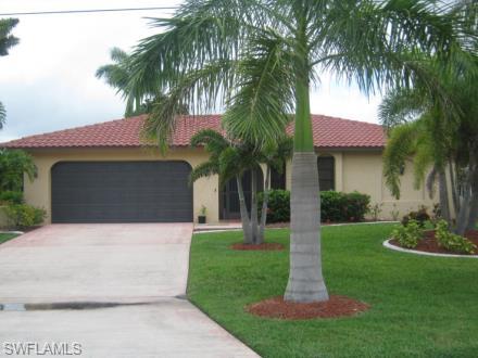 ***Show for backup offer***.Lovely pool and spa home with lots of tropical landscaping in the heart of the 8 Lakes Area of Southwest Cape,near Yaght Club and Tarpon Point. Boat storage is available close by if you have the need. This home is priced to sell and perfect for your entertaining with an updated kitchen, granite counters,nice large pantry and overlooks owners nice  new rec room with built in bar .City water and sewer are in and assessments are paid.It is a split bedroom plan and easy to show.
