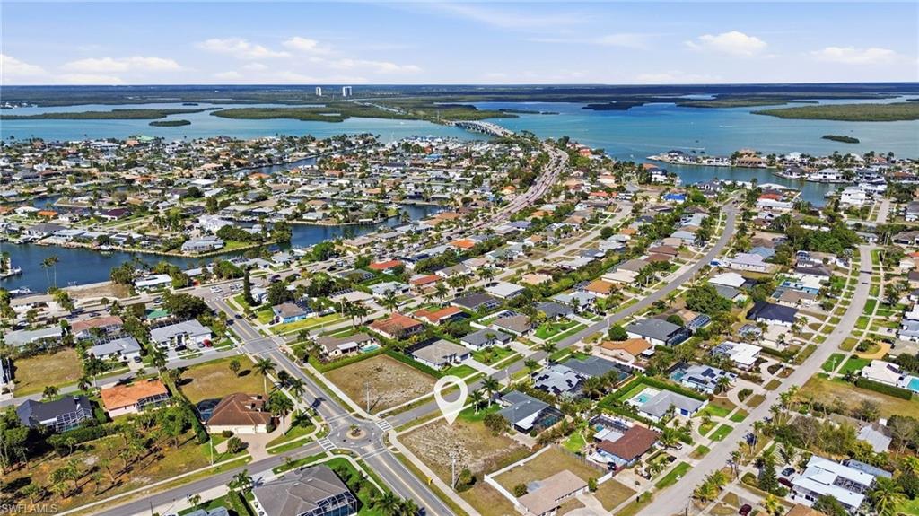 Build your dream home on this exceptional corner lot on Beautiful Marco Island, perfectly positioned with rear eastern exposure  Enjoy stunning sunrises and gentle morning light while keeping your future outdoor living spaces comfortable throughout the afternoon.  With approximately .25 acres, this lot offers a space to design a custom residence with room for a pool, outdoor living  area equaling an ideal backdrop for entertaining or relaxing. You are minutes and even walking distance from shopping, beaches, boating and dining.  This is the perfect foundation for luxury island living.  Now is the time to create your vision in paradise!