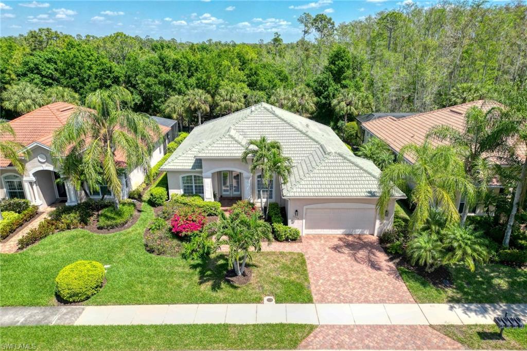 Discover serenity in the highly sought-after community of Bridgetown, where this peaceful sanctuary awaits. Ideal for nature enthusiasts, immerse yourself in the wonders of birdwatching, with sights of warblers and owls amid the swaying palms and majestic bald cypress trees. Step into this inviting 2BR+Den/2BA pool home, where an open floor plan seamlessly merges indoor and outdoor living. Admire poolside views through expansive mitered glass windows and sliders, connecting the living room and master suite to the lanai. The spacious living area boasts a stylish tray ceiling and recessed lighting, complemented by a den with charming wood flooring. Neutral tile floors grace the home, while plush carpeting adds comfort to the bedrooms. Retreat to the expansive master suite, featuring a tranquil sitting area overlooking the pool and preserve. Indulge in the luxurious master bath, complete with separate sinks/vanities, a soaking tub, and a walk-in shower. Flooded with natural light, the residence boasts glass fronted double doors, sliding glass doors, and large windows framing picturesque views of lush foliage and a park-like island. THERE ARE ONLY A FEW HOMES WITH THIS INVITING FLOOR PLAN OFFERING 12FT CEILINGS AND A TIMELESS STYLE. ALTHOUGH BUILT IN 2007, ONLY TWO OWNERS HAVE USED THIS AS A PART TIME VACATION HOME FOR THEMSELVES. NEVER RENTED. Enjoy the community's extensive amenities, including lap and resort-style pools, a rejuvenating spa, gym facilities, tennis courts, pickleball, Bocce, and more. Conveniently located in town, relish urban conveniences while savoring the tranquility of your peaceful preserve setting. NEW POOL HEATER & PUMP IN 2023.  Roof pressure washed in 2023.  The home, lania, screens & walk-way were pressure washed in 2024.