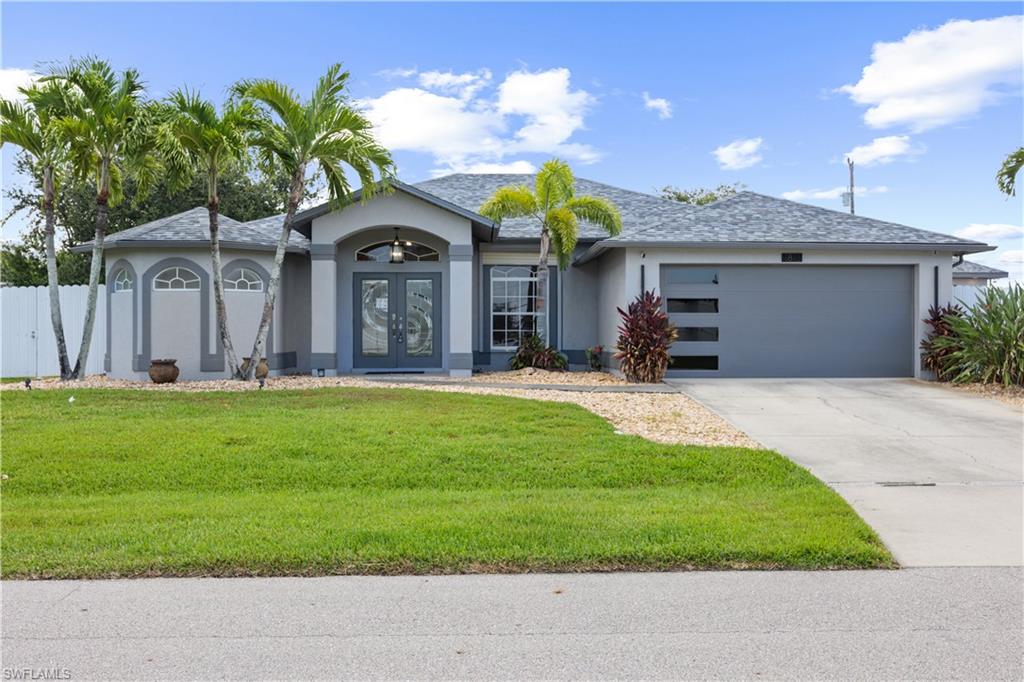 Location, Location, Location! This beautifully maintained 2,245 sq. ft. home with a detached 900 sq. ft. in-law suite in a 0.37 acres lot, is ideally situated just minutes from Veterans Parkway and Country Club Boulevard, offering convenience and accessibility in one of the area's most desirable locations in Cape Coral.

This exceptional property features 5 spacious bedrooms, 3 full bathrooms, and an upgraded heated pool complete with a summer kitchen, creating the perfect setting for relaxing or entertaining year-round. Connected to city water and sewer, the home combines comfort with practicality.

Designed to impress even the most discerning buyer, this home includes upgraded appliances, tile flooring throughout, 8 ceiling fans, and both electric and manual hurricane shutters for added peace of mind.

Situated on a rare triple lot, the property boasts beautifully landscaped gardens and a variety of mature fruit trees, providing both privacy and a serene outdoor retreat.

With its unbeatable location, outstanding features, and meticulous upkeep, this one-of-a-kind property truly has it all. Don't miss this incredible opportunity—schedule your private showing today. You won't be disappointed!