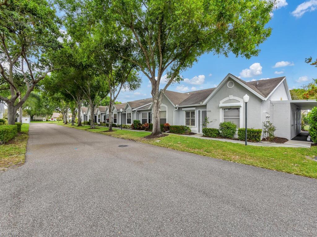 *MULTIPLE OFFERS HAVE BEEN RECEIVED* PLEASE SUBMIT all offers by Sunday, May 1st by Noon. Match your home to your lifestyle!  Greetings from the front door welcome you with gorgeous laminate flooring throughout and both bedrooms to your left and right.  Straight from the long entryway, you will be lead to the living area to your right and dining area to your left.  The chef in you will be pleased to find granite countertops, plentiful counter space, and bright light  to wow any events that you plan!  Entertainment is made easy with spill-over counter space to seat your guests as an added bonus to this eat-in kitchen.  Enjoy your enclosed lanai that lives like a second living area via both the kitchen and living area.  This home includes storm shutters off the lania, laundry in residence, carport space, and close proximity to the community pool for peace of mind.  Regent Park is located in North Naples, one of the best school systems in Collier County.  West of I-75, you are only 5 minutes from the interstate, 10 mins from the beach, and a 20 minute drive to Downtown Naples!
