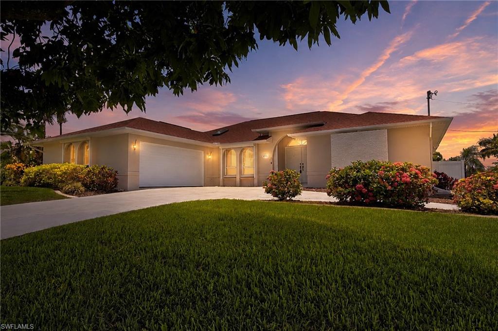 Rare Waterfront Opportunity with Direct Gulf Access & NO BRIDGE RESTRICTIONS! Sitting high and dry, discover the ultimate Florida lifestyle in this beautifully maintained 3-bedroom, 2-bathroom pool home located in desirable SE Cape Coral, featuring over 100 feet of water-frontage and endless boating possibilities right from your own backyard.

From the moment you enter, you’ll appreciate the spacious open living area with soaring vaulted ceilings, abundant natural light, and breathtaking views of the intersecting waterways. The living room and primary suite both offer sliding glass doors leading to the expansive lanai and pool area, while the guest bath includes convenient pool access for effortless outdoor living and entertaining.

The beautifully appointed kitchen is designed for both everyday living and hosting guests, featuring elegant granite countertops, a large center island with seating, built-in cooktop, stainless steel appliances, generous cabinetry, a spacious pantry, and a pass-through window overlooking the lanai. The charming eat-in kitchen area is enhanced by a skylight, bringing in beautiful natural light throughout the day.

This home has been lovingly cared for and thoughtfully updated with newer ceiling fans, updated fixtures, new toilets, refreshed shelving, a recently retiled pool bath with new shower doors, and so much more. The oversized screened lanai is truly an outdoor oasis, featuring a sparkling pool with a newer heater and pump, a beautifully restored lanai cage, and plenty of space to relax, entertain, and enjoy the Florida sunshine.

Boating enthusiasts will love the reconditioned dock featuring a 7,000 lb boat lift (accommodates up to a 23-ft boat), new remote-controlled boat enclosure, and a launch-and-stow kayak dock system — all ready for your next waterfront adventure. The private fenced backyard offers peace and privacy with mature landscaping, including mango and jackfruit trees.

The spacious primary suite provides a private retreat with a large walk-in closet, dual vanities, luxurious soaking tub, and tiled walk-in shower. Additional features include an enlarged two-car garage, circular driveway, electronic shutters on the front and rear of the home, Roof Replacement in 2019, updated A/C system, and plenty of room for vehicles, storage, and toys.

This exceptional Gulf Access home combines comfort, privacy, and waterfront living in one incredible package. Don’t miss your chance to own a piece of paradise in Cape Coral — schedule your private showing today! Home furnishings are negotiable.