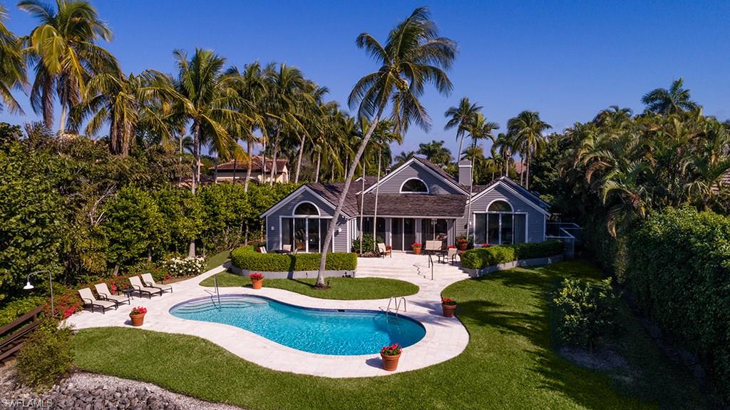 Beautiful environmental views along quiet Old Harbour Channel. Very quick boating access to Gordon Pass and the Gulf of Mexico. Not far, as well, from all the amenities of the Port Royal Club, with its world class dining and beachfront experience. The Port Royal Club's superb tennis center and fitness facility are also within easy reach. The home is a comfortable and easily managed one-floor design. Superior spatial relationships allow a very private master bedroom with exceptional water views. Two guest bedrooms with an additional entirely separate bedroom suite accommodation for staff or longer term visitors. Large living room with fireplace and connecting outside screened porch overlooking the pool and tree-lined waterway beyond. Wonderful family/dining room with open kitchen to meet the desires of modern living. A beautiful site and an exceptionally lovely home. Port Royal Club eligibility.