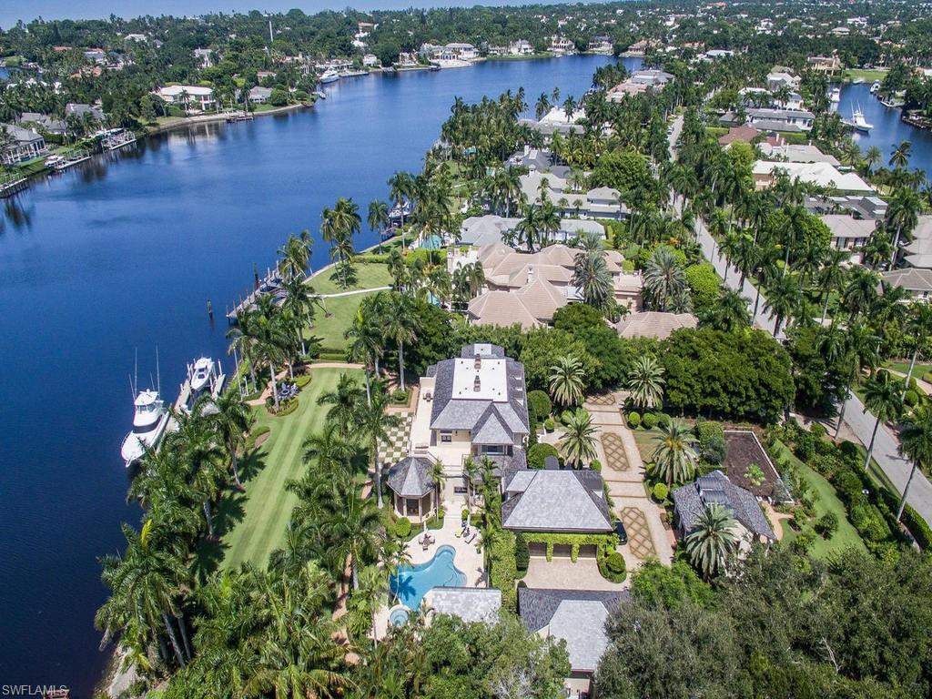 This significant waterfront estate with dual gated driveways includes two large master bedrooms, a chefs kitchen and poolside cabana. The six bay collectors garage holds nine cars, with a separate guest house or nanny quarters. This property boasts phenomenal views from every room to ensure maximum relaxing or entertaining. A 1000 bottle wine room, state of the art electronics and whole home automation ensure quality of life and lifestyle. Outdoors the organic vegetable, fruit and butterfly gardens are unsurpassed in variety and quality. This home has been completely redone with hospital grade A/C ductwork, new plumbing and three new water heaters. The entire home water filtration system is new as well as all electrical panels and security system. Stunning outdoor space with wood burning fireplace adds ambience to the pool redone with mother of pearl glass tiles. The open and airy cabana sits serenely on 200 hundred feet, with a spectacular 100 foot floating dock on Galleon Cove.
