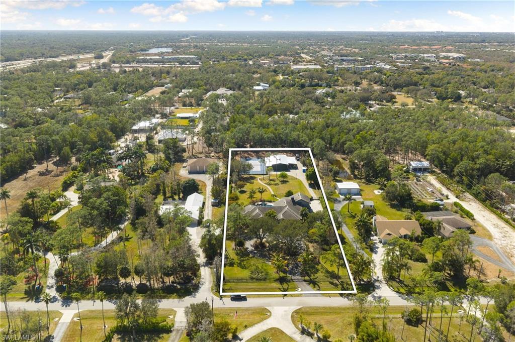 Welcome to 6610 Sable Ridge, one of Naples' most unique private estates. Set on 2.73 gated acres in the heart of Naples with no HOA, this exceptional property offers a lifestyle rarely available in Southwest Florida. More than a luxury home, it is a private sports and wellness compound designed for those who value space, recreation, privacy, and convenience just minutes from Naples' beaches, shopping, dining, and top-rated schools.  Unlike traditional luxury homes that maximize square footage on small homesites or rely on community amenities, 6610 Sable Ridge offers the freedom to enjoy your own resort without leaving home.  The property features a private tennis court with two lined pickleball courts, including one covered court for year-round play. Two fully air-conditioned detached buildings create the ultimate wellness retreat, with one serving as a private fitness studio and the other designed as a stylish lounge complete with a kitchenette. Combined with the resort-style pool and spa, expansive lawns, and mature landscaping, the property feels more like a private club than a residence.  Inside, the warm modern home offers 5 bedrooms plus a den, 4 full baths, and 1 half bath with thoughtful updates throughout. The renovated kitchen (2021) anchors the home, while every bathroom has been beautifully remodeled with timeless finishes that blend comfort with contemporary style.  Southern exposure fills the outdoor living areas with natural light throughout the day, making the pool, spa, and entertaining spaces equally inviting for quiet mornings or gatherings with family and friends.  The spacious 28-by-22-foot upstairs fifth bedroom offers incredible flexibility as a media room, guest suite, game room, home office, or private retreat. An oversized attached four-car garage provides exceptional space for multiple vehicles, golf carts, recreational equipment, a workshop, or additional storage, making it ideal for an active lifestyle.  6610 Sable Ridge is not defined by the home alone. It is defined by the lifestyle the entire property creates. Very few Naples estates offer nearly three acres of privacy, resort-caliber sports amenities, dedicated wellness spaces, an oversized attached four-car garage, and the freedom of no HOA, all from one of the city's most convenient central locations.