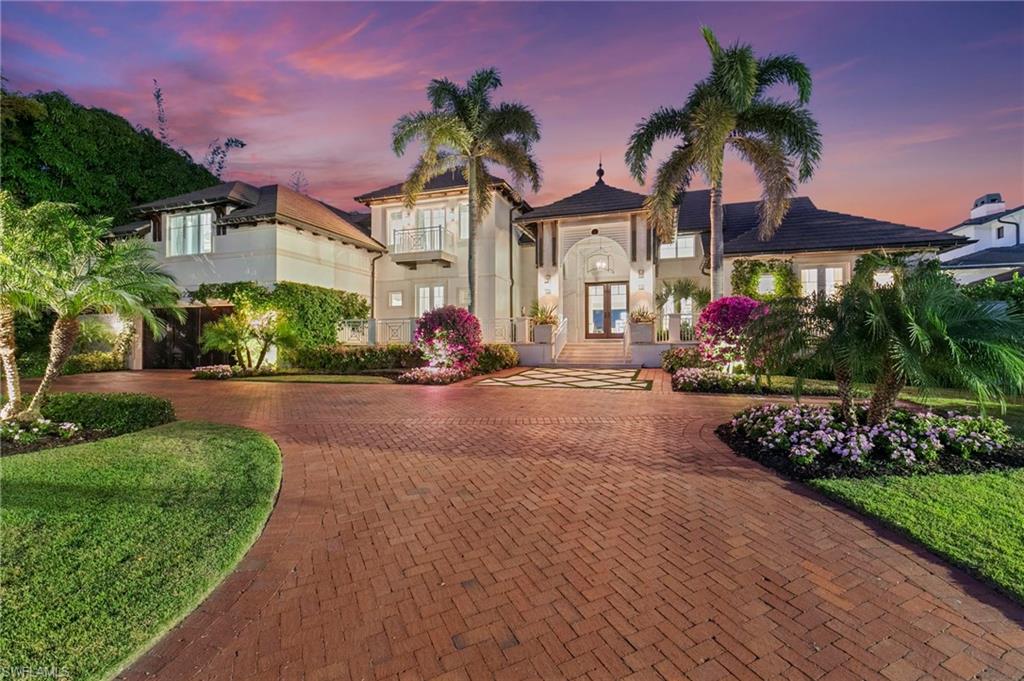 Welcome to 221 Aqua Court, an exceptional water-direct residence in the heart of Aqualane Shores. This home offers a rare coastal lifestyle with effortless access to both the water and the beach—located just one block from the Gulf’s white-sand shores.

Perfectly positioned on one of the widest water settings in the cove, the property features true no-bridge access to the Gulf and is within walking distance of the premier boutiques and dining of 3rd Street South.

Re-envisioned in 2021 by Kurtz Homes with architectural design by Stofft Cooney Architects, the residence reflects a masterful balance of timeless architecture and modern sophistication. At the heart of the home, an enclosed lanai seamlessly connects the main living spaces to the pool terrace, blurring the line between indoor and outdoor living.

The home offers seven beautifully proportioned rooms, providing remarkable flexibility for guest suites, a private gym, a home office, or a media room. Upstairs, a second-floor deck provides a tranquil vantage point over the water, while a distinctive upper-level retreat featuring custom bunk beds and a swing adds unique warmth and charm.

With water-direct boating, close proximity to the beach, and walkable access to Old Naples’ most beloved destinations, this property offers a lifestyle defined by ease and elegance.