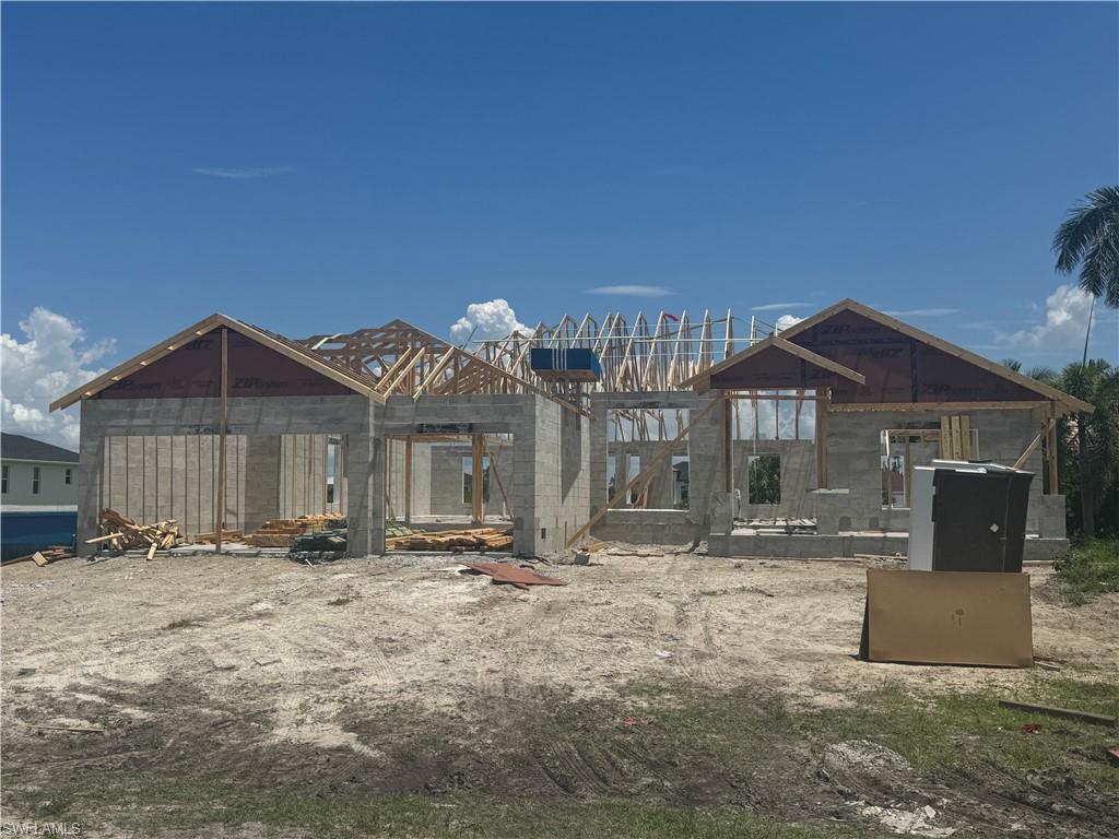 ASK ABOUT INCENTIVES! NEW CONSTRUCTION = Inexpensive Homeowner's insurance with HIGHER ELEVATION + NEW WIND LOAD BUILD CODES + energy efficiency. This home comes Standard with a comprehensive Builder Warranty for 1/2/10 years. Come and see why this is our Top Selling Plan - This is the Perfect 4 bedroom, 3 bathroom, 3 car garage ranch with 2265 sq ft of highly functional space in a gorgeous section of Booming NW Cape. Large covered front porch, stone accenting, large covered rear lanai, Plank Tile & Granite Throughout, Large 23' x 8' covered lanai, HIGH ceilings, Bright Natural Lighting, a Parade of Homes winner for best feature "Integrated Family Living Space" *MLS Listing Data Subject to Errors & Omissions**Price & Availability Subject to Change*