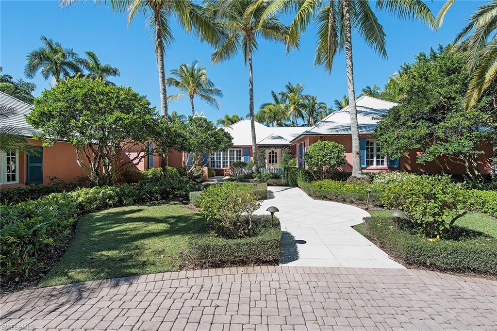 Situated on 1.5  lots with western exposure this large waterfront Galleon Drive property is ideal for Naples coastal living.  The lot enjoys over 155 feet of waterfront.  The existing home and outside gardens are a charming reminder of early Port Royal.  The home's gourmet kitchen, elegant living and dining areas are complemented by a private master bedroom/bathroom suite with separate sitting area, den and wine room.  Port Royal Club membership eligibility.