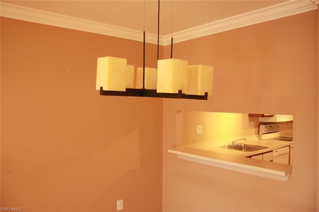 Prime Location!!! Welcome to Woodgate At  Naples one of the most desired communities in East Naples FL. This wonderful second floor condo has been updated and  painted,  featuring nearly 900 Sq. Ft of living space, 2 large Bedrooms, 2 Full Bathrooms, and 1 car space assigned with extra guest parking. updated kitchen, newer appliances, newer light fixtures, crown molding , newer washer and dryer, and much more. Spacious Master Bedroom, large walk-in closet, tile & laminate wood flooring in all living areas . Step out to the screened lanai. With peaceful views of the lake, very low  HOA fees including water, lawn care, and pest control. New roof. Great community pool within steps of your doorstep. Close to beaches, shopping, and restaurants in both Naples and Marco Island. This is a great investment opportunity or way to affordably live in paradise. Hurry to take advantage of this incredible deal!. This home will not last long.