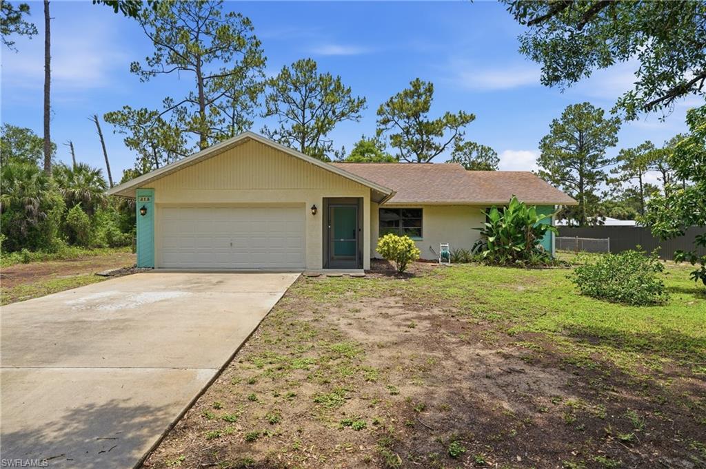 SELLER OFFERING AHS HOME WARRANTY WITH PURCHASE!
Welcome home to this charming Lehigh Acres residence offering the perfect blend of space, comfort, and functionality. Step inside to an open-concept floor plan featuring soaring high ceilings and a separate dining room ideal for gatherings and everyday living. The bright and airy kitchen is designed for both style and convenience, boasting abundant counter space, a spacious pantry, and excellent flow to the main living areas.

An enclosed front entryway provides a welcoming first impression, while the screened-in back patio is made for entertaining with a convenient pass-through window from the kitchen and direct access to a dedicated bathroom. Outside, enjoy a large fenced backyard surrounded by mature trees that provide privacy and shade.

Conveniently located near shopping, dining, schools, parks, golf courses, and everyday conveniences, with easy access to Fort Myers, RSW International Airport, and Southwest Florida's beautiful Gulf Coast beaches. Whether you're looking for a full-time residence or seasonal retreat, this home offers exceptional value and Florida living at its best.