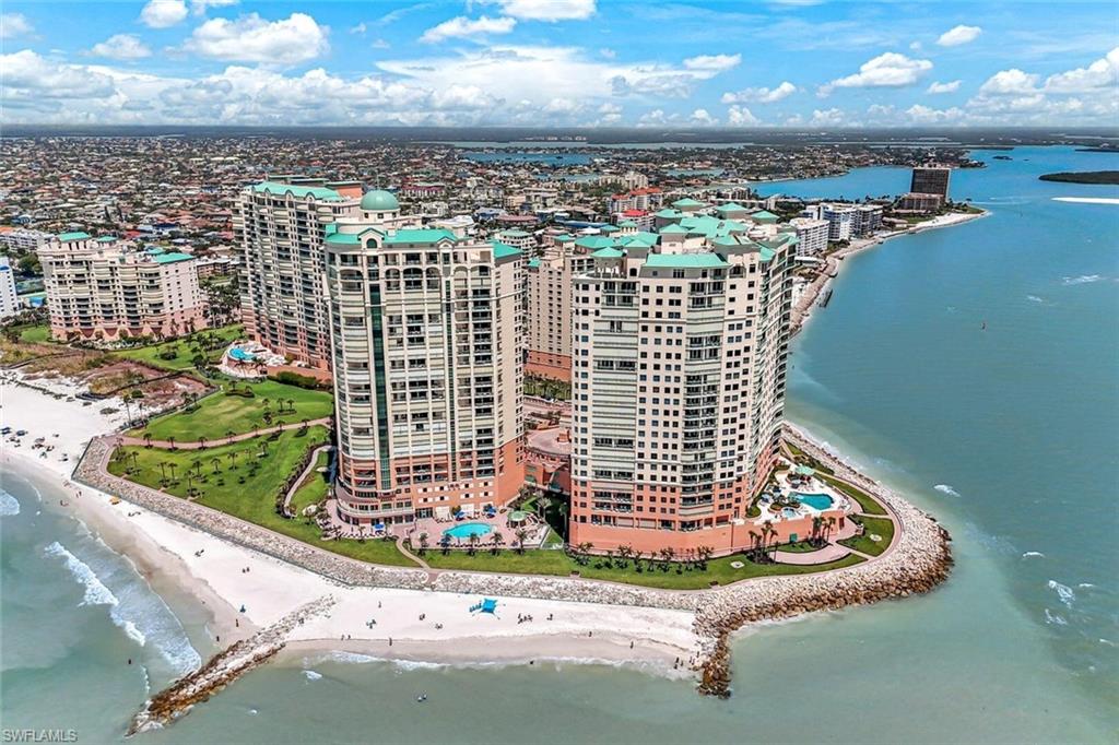 Perched above the shimmering Gulf waters this exceptional 3600 a/c sq ft, 3-bedroom, 3.5-bath residence offers expansive living and family room areas, a spacious den, and soaring 11-foot ceilings—available only in select units. Floor-to-ceiling impact sliders and windows frame the breathtaking panoramic views of the Gulf of America, the 10,000 Islands, and Marco Island. Designed for both comfort and elegance with  luxurious open living spaces and sweeping water views, this residence is a true coastal retreat.