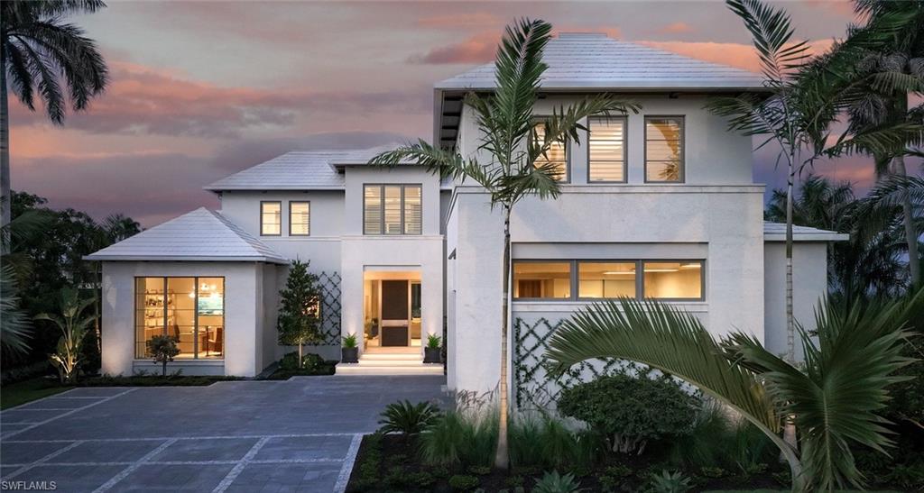 London Bay redefines luxury and encapsulates the essence of Naples’ exclusive Port Royal lifestyle in this stunning waterfront estate, which boasts 107 feet of Hidden Bay shoreline and direct access to the Gulf of Mexico. The estate’s architecture, designed by the acclaimed Kukk Architecture & Design, makes a bold statement and includes all the necessary amenities for stylish entertaining. Interior design, furnishings, finishes, and custom selections by Romanza Interior Design create a unique palette that balances elegance and effortless living. The soft contemporary aesthetic features limestone floors in the main living areas and pewter white oak wood flooring in the primary suite, study, and throughout the second floor. The open floor plan captivates with expansive living spaces, all offering beautiful bay views. Pocketing Weiland lift-and-slide doors seamlessly extend the spacious great room, kitchen, and dining area to both covered and open-air alfresco living spaces with uninterrupted flush flooring. The kitchen is tailored with Poliform cabinetry and an oversized island, a Galley workstation sink, and a built-in table for casual dining. The elegant primary suite includes an impressive gallery and a boutique-style oversized Poliform walk-in closet with custom Casali doors. Featuring luxurious dual baths connected by a shared shower, this light-filled suite boasts walls and ceilings adorned with Venetian plaster and floor-to-ceiling glass leads to a tranquil outdoor retreat. The second floor offers a VIP suite and three spacious en-suite guest rooms, as well as a dedicated exercise studio and a second laundry room that encircle a well-appointed loft. The loft features a morning kitchen and sliding glass doors that open to a bay-facing balcony. The covered lanai provides outdoor living, dining, and a large well-equipped kitchen for entertaining. Water cascades from the raised spa into the infinity edge pool’s sun shelf, which is connected by stepping stones leading to a sunning deck and a secluded lounge with a fire table. The estate also includes the conveniences of an air-conditioned three-car garage, elevator, and a generator. Eligible for Port Royal membership.