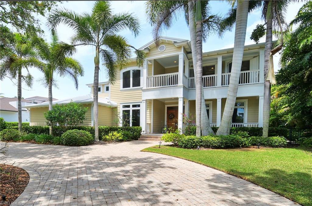 Gorgeous custom Florida style home, designed by the architect Richard Lee Wu and built to last wiht exceptional materials and finishes, by builder for his daughter, in the heart of Moorings, with its volontary  private beach membership. Large 5 bedrooms and two dens, 6 bathrooms, large media room, gournet kitchen with 6 burner gas range, granite countertops, double oven, kitchen island.Oak floor graces the floors throughout. Open floor plan for easy living and great entertaining. The Master suite opens to the pool through French doors. Upstairs are the 4 other bedrooms and a large media room with kitchenette and its own terrace overlooking the pool. The enclosed pool area is spectacular and totally private, has its own half bathroom. Large lot with lush landscaping.
