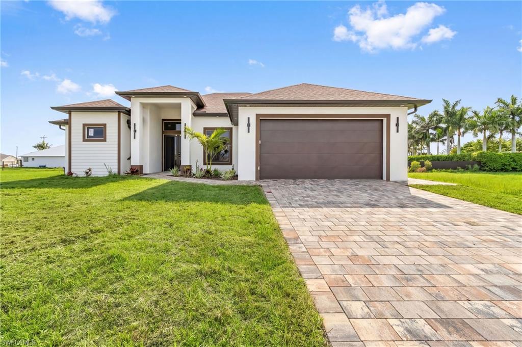 LOCATION! Welcome to 7 SW 19th Pl, Cape Coral, a stunning brand-new modern residence designed with elegance, comfort, and functionality in mind. From the moment you enter, you'll be impressed by the **soaring high ceilings**, open-concept design, and abundance of natural light that create a bright and spacious atmosphere throughout. Thoughtfully crafted with **beautiful high-end finishes**, designer touches, and exceptional attention to detail, this home offers the perfect blend of luxury and everyday living. Whether entertaining guests or enjoying a quiet evening at home, this property delivers the modern Florida lifestyle you've been looking for.