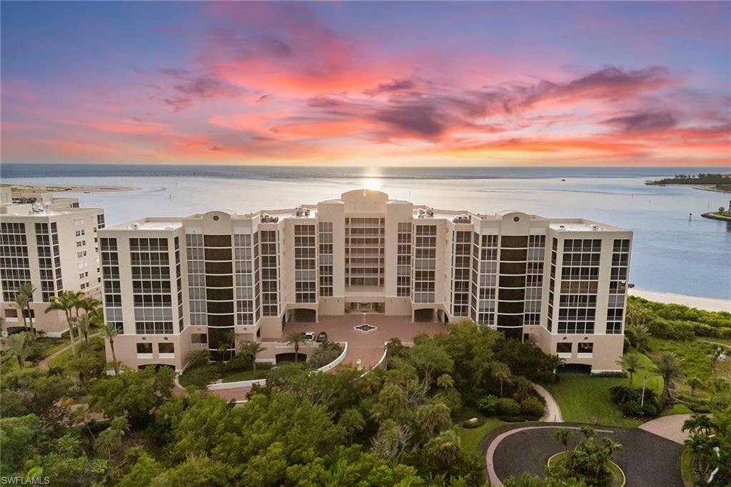Experience elevated coastal living in the prestigious private gated community of Hideaway Beach on beautiful Marco Island. This spacious 4-bedroom, 3-bath residence offers stunning sunset and sunrise views, with sweeping outlooks of the beach, Gulf, and Collier Bay.  The open floor plan is filled with natural light and flows seamlessly into a glassed-in lanai, creating an exceptional indoor-outdoor living experience. From this inviting space, enjoy views of white sandy beaches, passing boats, and dolphins at play. The gorgeous kitchen features upgraded high-quality cabinetry and appliances, a breakfast bar, an eating area, and a pantry. The home also includes two air-conditioning systems with separate zones, two large hot water heaters, and thoughtful details throughout. The unit was significantly renovated and upgraded in 2015. The primary suite retreat offers a large walk-in closet, dual sinks, a bidet, and a spacious walk-in shower. Offered turnkey furnished with elegant furnishings, this residence is move-in ready. Additional conveniences include extra storage, two covered parking spaces, and a dedicated golf cart space. Riviera offers excellent amenities, including a large, heated lap pool, spa, fully equipped gym, community room with kitchen, onsite manager, and private access to the beach and Gulf. Hideaway Beach is a world-class gated community with 24-hour security, a brand-new state-of-the-art sports center, beachfront clubhouse with multiple dining venues, championship golf course, pickleball, bocce ball, tennis, fitness center, and more than two miles of pristine white sand beach. Come experience the lifestyle you’ve been waiting for—luxury, serenity, and coastal living at its finest.