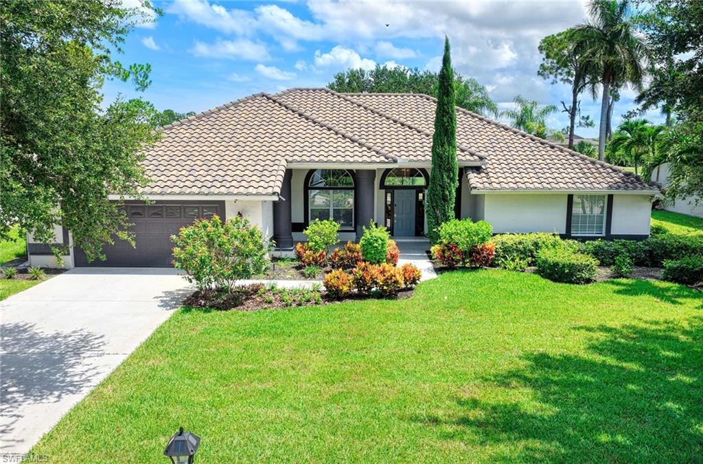 Stunning golf course home in Palmetto Dunes at Lely Country Club, overlooking the private Royal Palm Golf Course. Single-story, 3 bedrooms, 2 baths, 2,430 sqft under air, oversized 2-car garage. Fully remodeled kitchen and living room featuring quartz countertops and custom cabinetry. Brand-new primary suite bath (2026) — freestanding soaking tub, frameless rain shower, dual vanity, LED mirror, designer tile. New HVAC system 2025. Pool heater replaced 2022. Expansive screened lanai with private heated pool and spa (iAqualink smart automation, new pump), covered outdoor living area with fire pit conversation seating, outdoor dining fire table, and hammock. Sonos surround sound throughout living, dining, and pool deck. Smart Rachio irrigation on a private well — no city water cost for watering. Lush tropical landscaping with mandarin, avocado, and lime trees plus hibiscus, birds of paradise, and mature palms. Concrete tile roof replaced 2018. SimpliSafe security. New washer and dryer 2026. Fully furnished and turnkey. Low HOA. Minutes to Fifth Avenue, Naples beaches, and RSW Airport.