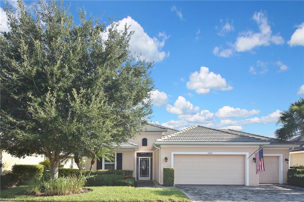 Welcome to this exceptional Sandbar Model home in the highly sought-after community of Sandoval, where lush tropical landscaping, abundant wildlife, resort-style amenities, and a vibrant social atmosphere create the ultimate Southwest Florida lifestyle. This award-winning floor plan is thoughtfully designed for both everyday living and entertaining, offering just under 2,300 square feet of living space with 3 bedrooms, 3 full baths, a spacious den, and an oversized 3-car garage.
Proudly offered by the original owner, this meticulously cared-for home showcases pride of ownership throughout. The screened front entryway with a decorative glass entry door welcomes you inside while allowing the desirable Florida cross breeze to flow through the home. A triple sliding glass door and an additional slider spanning the length of the home seamlessly connect the indoor living space to the expansive outdoor area, creating the perfect setting for enjoying the Florida lifestyle.
The open-concept great room design is ideal for entertaining family and friends, with a spacious kitchen serving as the heart of the home. The oversized flat island, enhanced with additional cabinetry underneath, provides exceptional workspace and storage. Stainless steel appliances, under-cabinet lighting, and abundant cabinetry make this kitchen a chef’s delight. Multiple tray ceilings add architectural detail and elegance throughout the main living areas and the primary suite.
The primary suite offers generous space and privacy, featuring a spa-like ensuite bath with dual sinks, a large walk-in shower, and an oversized walk-in closet. Two additional guest bedrooms provide comfort and flexibility for family or visitors, including one bedroom with its own ensuite bath—perfect for guests or a private mother-in-law suite. The separate den offers additional versatility, ideal for a home office, media room, or additional living space.
Step outside to your private outdoor oasis featuring a large covered lanai and refreshing pool area, complete with Storm Smart electric hurricane shutters for added peace of mind and protection.
The laundry room is exceptionally spacious and offers convenience with upgraded washer and dryer, extensive cabinetry, and a convenient sink. 
Additional features include accordion hurricane shutters protecting all windows and hurricane-rated garage doors, providing added security and storm protection.
Sandoval offers an unmatched lifestyle with a secure gated setting, resort-style pool, clubhouse, fitness center, tennis and pickleball courts, volleyball, basketball, dog parks, walking paths, and a full calendar of activities designed for an active and social community. This beautifully maintained home combines comfort, functionality, and the best of Florida living.