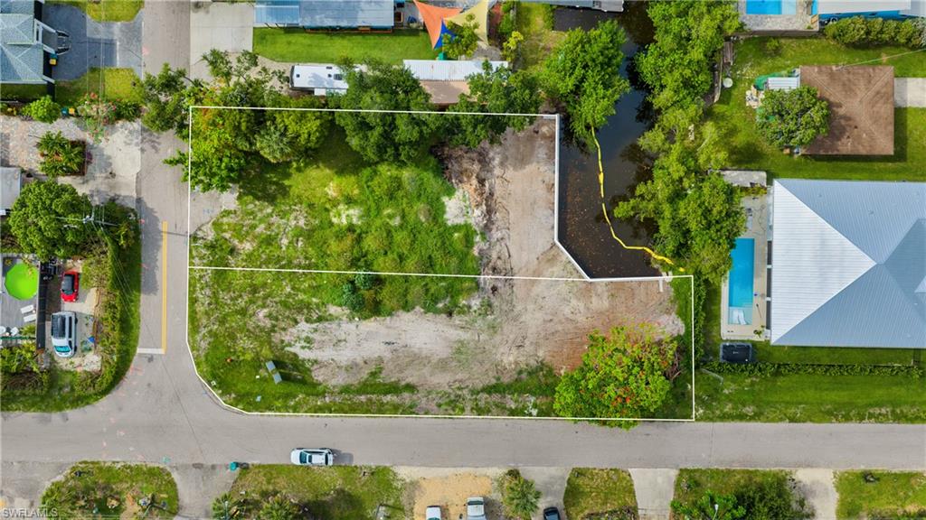 0.14 acres zoned residential for single-family or duplex development! Brand new SEA WALL. Fully upland, level lot offers public utilities and NO HOA, creating an exceptional opportunity to build in the rapidly growing Bayshore District of Naples. This homesite is surrounded by new coastal-inspired construction and luxury residences, making it the perfect setting for a custom home tailored to your lifestyle providing endless potential. Minutes from Downtown Naples, 5th Avenue South, Gulf beaches, marinas, dining, shopping, and entertainment, the location offers both convenience and long-term value. Enjoy close proximity to Celebration Park, Naples Botanical Garden, Rebecca's Wine & Jazz Bar, local cafés, art galleries, and the expanding collection of restaurants and lifestyle destinations that continue to transform the Bayshore area. With inventory becoming increasingly limited in this evolving area, 3439 Canal Street presents a rare opportunity to secure a prime piece of Naples real estate and build your dream home!
