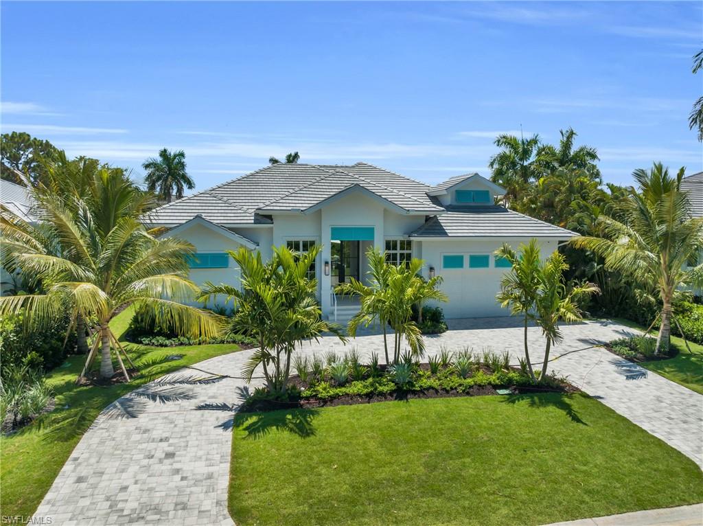 Borelli Construction has completed their newest luxury home in the desirable Point West enclave inside Park Shore. Clive Daniel Home, an award-winning interior design firm, furnished each space in the home exquisitely to provide flow and comfort. Enjoy all the benefits of a single family home with the added bonus of having a community pool and park, shared with only fifteen other neighbors, plus all the perks of the Park Shore Association. The home has all of the high quality features you expect from Borelli including European white oak wood flooring throughout, Andersen impact windows, spray foam insulation, extensive trim work, solid wood custom cabinetry, all closets built out, AV included, SubZero & Wolf appliances and a whole house generator running off of a 1,000 gallon underground propane tank. The floor plan provides flexibility to function as a three en-suite bedroom home plus home office with bathroom + closet OR a four bedroom with en-suite bathrooms depending on your lifestyle. You can easily entertain with the great room floor plan, well-equipped wet bar, built-in outdoor kitchen and your own gas-heated pool & spa. The 10-foot PGT impact sliders open to two sides to create the indoor-outdoor living to enjoy the beautiful Florida weather. The spacious covered lanai has motorized screens and shutters and just beyond the lanai is an expansive pool deck with open park views. The primary suite is situated on one side of the home and features separate closets with LED lighting and beautiful bathroom with a large shower and separate soaking tub. Just inside the home from the garage is a key drop space for added storage and organization. Park Shore Court is a quiet street, centrally located within Park Shore and just down the road from the private beach access, but still so close to main roads to quickly get around town.