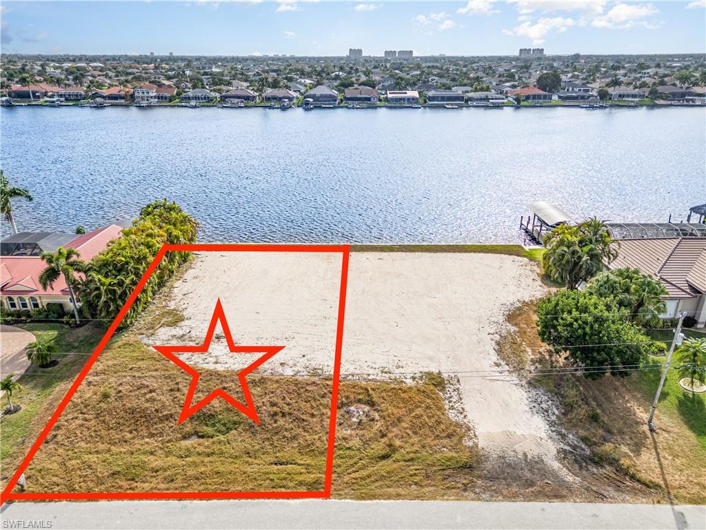 This is a one of a kind lot that has everything you have been searching for to build your new SW Florida dream home. You’ll enjoy amazing SOUTHERN EXPOSURE VIEWS across Lake Finisterre, the largest GULF ACCESS lake in Cape Coral. Being in the middle of the lake provides outstanding sunrise and sunset views. The lot also provides fast gulf access under the tallest bridge in SW Cape Coral with a quick ride out to Cape Harbour with four waterfront restaurants and Marina Village with six waterfront restaurants. On top of the OUTSTANDING VIEWS and GREAT GULF ACCESS the lot itself has a brand-new seawall with taller 10’ panels and it is oversized offering 6.5’ +/- more in buildable depth than a typical lot. The lot is also pre-filled saving thousands in construction costs. This lot will fit most every builder’s model home and there is a great custom home plan available which was designed to take advantage of this extra lot depth. This is a one-of-a-kind lot rarely available. Take a look today.