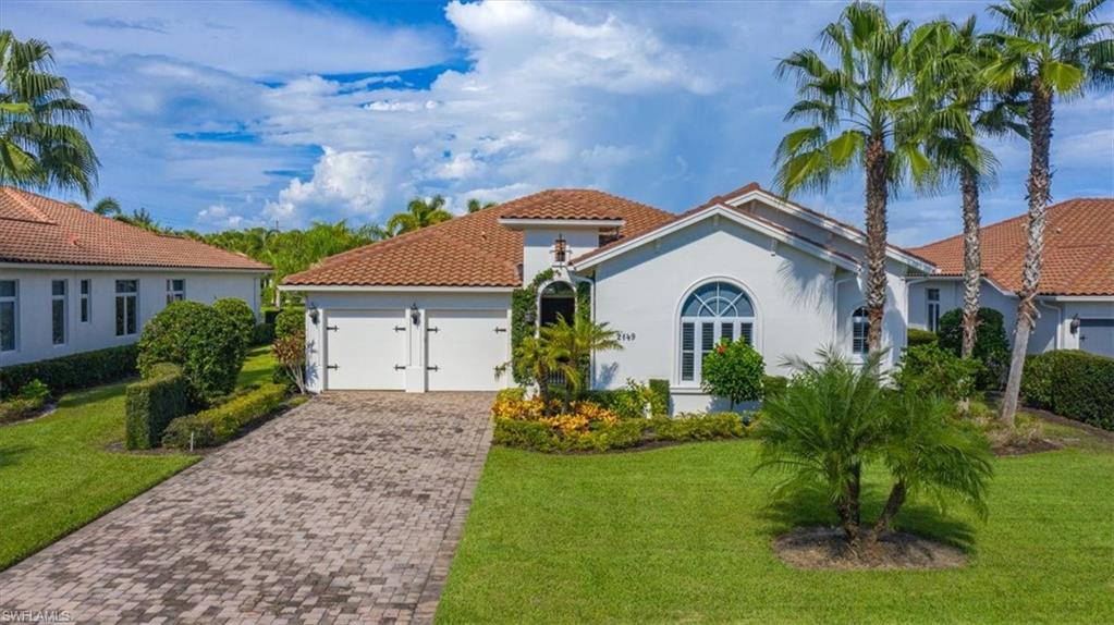 Freshly painted and newly priced, this beautiful home is sited on a deep lot with a custom west-facing pool.  Embraced by lush hedges, this house draws you in. Drenched in natural light, it exudes a warm, coastal vacation atmosphere. The open great room floor plan features a wall of glass overlooking the pool, spa and lake. Off the great room is a bright kitchen with granite counters, a tray ceiling, custom lighting and a huge island. There’s a gracious dining room and a large den with double doors - which is perfect for overflow guests. There are high ceiling and crown moldings throughout. The large owner’s suite is complimented by a beautifully appointed bath and ample closets. There are two additional guest bedrooms with walk in closets, both en suite. A large travertine patio and pool deck completes the package. This home is being sold turnkey furnished, golf cart included.