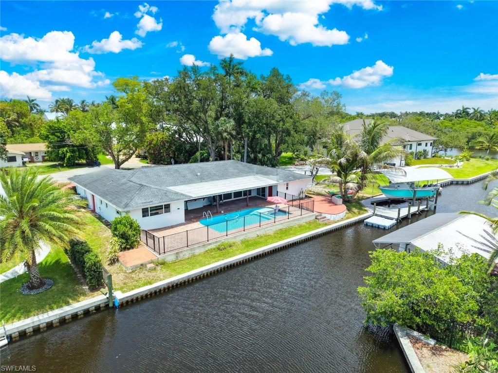 Stop Looking- This is the One!!  Imagine ending each day with a sunset cruise, knowing you're just five minutes from the river. Perfectly positioned just off McGregor Boulevard in the sought-after Whiskey Creek area, this exceptional 5-bedroom, 3-bath waterfront pool home offers the Florida lifestyle you've been dreaming of.
Step inside to discover a beautifully updated kitchen featuring quartz countertops, stainless steel appliances, and plenty of space for gathering with family and friends. Recent upgrades—including a newer A/C system, pool equipment, a custom covered composite dock, and boat lift—mean you can spend less time on maintenance and more time enjoying life on the water.
Outside, your private backyard oasis invites you to relax by the pool, entertain under the Florida sunshine, or step aboard your boat for a quick ride to the Caloosahatchee River and beyond. Whether you're fishing, island hopping, or simply cruising at sunset, Gulf-access living doesn't get much more convenient.
Located just minutes from top-rated schools, healthcare, shopping, dining, and everyday conveniences, this home perfectly balances tranquility with accessibility.
This is more than a home—it's a waterfront lifestyle where every day feels like a vacation.
All furnished photos are virtually staged.