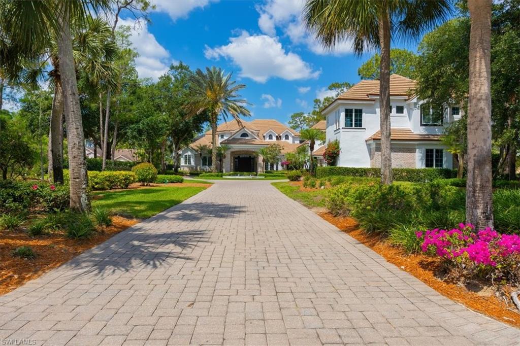 Step through grand double wooden doors into a sun-drenched foyer, where soaring ceilings over 20 feet high and sleek Italian porcelain tile flooring set a tone of elegance that extends throughout this 6-bedroom, 7-bathroom estate-style home. The expansive family room flows effortlessly into the gourmet kitchen, which is appointed with handcrafted Amish cabinetry, dual Dolomite-topped islands, and a designer butler’s pantry. Adjacent to the kitchen, the living room is anchored by a glowing, backlit onyx bar, while the daily dining area showcases panoramic views framed by floor-to-ceiling glass walls. Seamlessly blending indoor and outdoor living, the resort-style exterior features a marble-decked (salt) pool, an elevated spa, and lush landscaping. A covered outdoor living room includes a fireplace, mounted TV, and a chef’s kitchen complete with a grill, refrigerator, and bar seating for eight—delivering a perfect balance of luxury, comfort, and functionality in every detail.