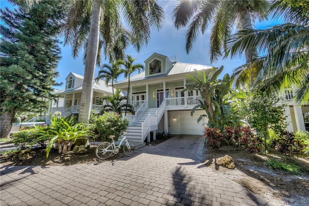 Captiva’s VILLAGE BY THE SEA!! Recently updated, this 4bed/4bath Old Florida style home is located in the heart of Captiva! ‘All Seasons Villa’ offers the best of the Island Lifestyle featuring its own private pool with a natural barrier plus proximity to shopping, marinas, and renown restaurants. Arrive through the lush landscaping and up the front staircase (or elevator) into the main level that is bright, airy, and spacious. An open floor plan boasting hardwood floors in the living areas, kitchen with granite counters, coastal furnishings, and multi-level decks installed with composite wood. Lower level offers expansive interior storage. A covered patio, artificial turf surrounding the heated pool, and an under building 2-plus vehicle garage with an additional storage area leading to the pool deck. Roof-top deck offers partial gulf and sunset views! Approximately 500 feet from the beach, this home is the epitome of what Captiva Island is all about!