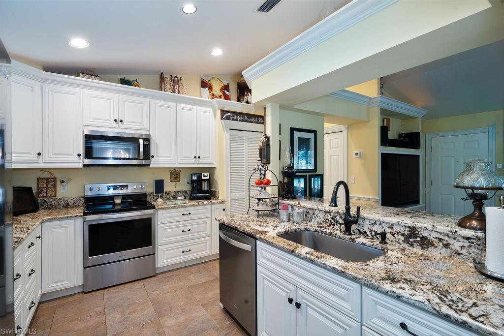 Option for buyers to purchase lot beside residential PID#40292320008 (1.59 Acres) if more acreage is needed. Residential home sets on 1.14 acres. Welcome Home! This charming 3-bedroom, 2-bath home features a detached 26x16 air-conditioned garage/workshop, along with a spacious 14x54 lanai, complete with a closed-in air-conditioned storage room. Natural light pours into every room, highlighting the open floor plan and inviting kitchen. The updated kitchen boasts granite countertops, 36-inch wood cabinets with large bottom drawers for ample storage, and soft-close mechanisms. You'll also find newer stainless steel Whirlpool appliances. High ceilings enhance the sense of space, with tile flooring in the entry, hallway, kitchen, and bathrooms, while Bruce oak hardwood floors add warmth to the living and guest bedrooms. The primary bedroom has new Bruce Oak Hardwood flooring for comfort. This home is equipped with whole-house impact windows, PEX piping, a reverse osmosis system with a 500-gallon tank, crown molding, chair railing, plantation shutters, and new gutters (2024). New Well Pump 1.5 HP, New Pressure Tank, Pressure Switch , Control Valve & Media tanks. The garage/workshop features metal manual shutters for added protection. All bedrooms offer walk-in closets, with custom closets in the guest rooms. Recent updates include a new Rheem A/C (May 2024), Rheem water heater (January 2023), and a newer Samsung washer/dryer. The lanai is also outfitted with new fans. Enjoy outdoor living in your spacious, partially fenced backyard with stunning views of nature. Watch a variety of wildlife, including birds, squirrels, rabbits, and deer. The paved driveway offers plenty of parking. Walking distance to canal at end of 22nd Ave for fishing, canoeing or kayaking. It is conveniently located near shops, restaurants, schools, and the new Collier County Park, Recreation, and Aquatic Center. Plus, there are NO HOA fees! Check out the feature sheet for more details. Bring your family and start creating lasting memories today!