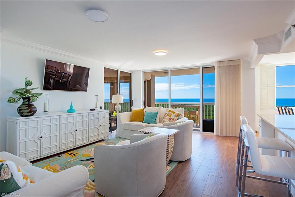 Enjoy the best of Naples seasonal living in this turnkey furnished sky home, available for your next getaway at the prestigious St. Kitts at Pelican Bay. This beautifully remodeled 11th-floor residence offers an exceptional seasonal rental opportunity with breathtaking panoramic views of the Gulf and the lush preserve. Inside, a spacious open floor plan seamlessly connects each room, creating a bright and inviting atmosphere. The residence features two bedrooms, two bathrooms, and a private balcony perfect for enjoying stunning sunsets and coastal breezes. Thoughtfully renovated, the open kitchen showcases granite countertops, a breakfast bar, tiled backsplash, and updated cabinetry. Additional highlights include luxury vinyl plank flooring, custom built-ins, a spacious primary suite with 2 full-sized beds, dual sinks, a walk-in closet, and a walk-in shower. One covered carport space is included for your convenience. St. Kitts is ideally located in the heart of Pelican Bay, offering easy access to the Marker 36 and Commons tram stations. As a seasonal resident, you’ll enjoy exclusive access to two private beach clubs with dining, 18 tennis courts, fitness and community centers, tram service through the preserve, and a world-class pickleball center coming soon. Building amenities include multiple social areas, a fitness center, an Olympic-size pool and spa, and a BBQ area, providing everything needed for an unforgettable seasonal stay.