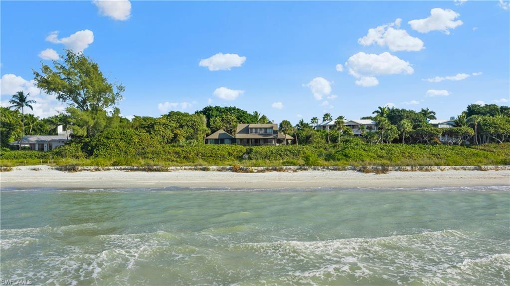 Privacy, tranquility and peaceful enjoyment can be found with this sprawling estate located along Sanibel's renowned West Gulf Dr. As you pull into the 1.7 acres of Gulf front land you'll notice hammocks hanging from large tropical shade trees and a beautiful home constructed on a high ridge to take advantage of the breathtaking Gulf front views. Sugar sand beaches stretch as far as the eye can see and this property offers a unique 200' of frontage along Sanibel's world famous beaches. Built to take advantage of coastal living this home offers soaring ceilings and an abundance of windows and lanais where sparkling waters of the Gulf of Mexico and spectacular sunsets can be enjoyed. This property also offers numerous possibilities including the unique ability to accommodate two structures. Make your Gulf front dream a reality and let the sound of waves greet you in the morning and spectacular sunsets bid you a pleasant evening.