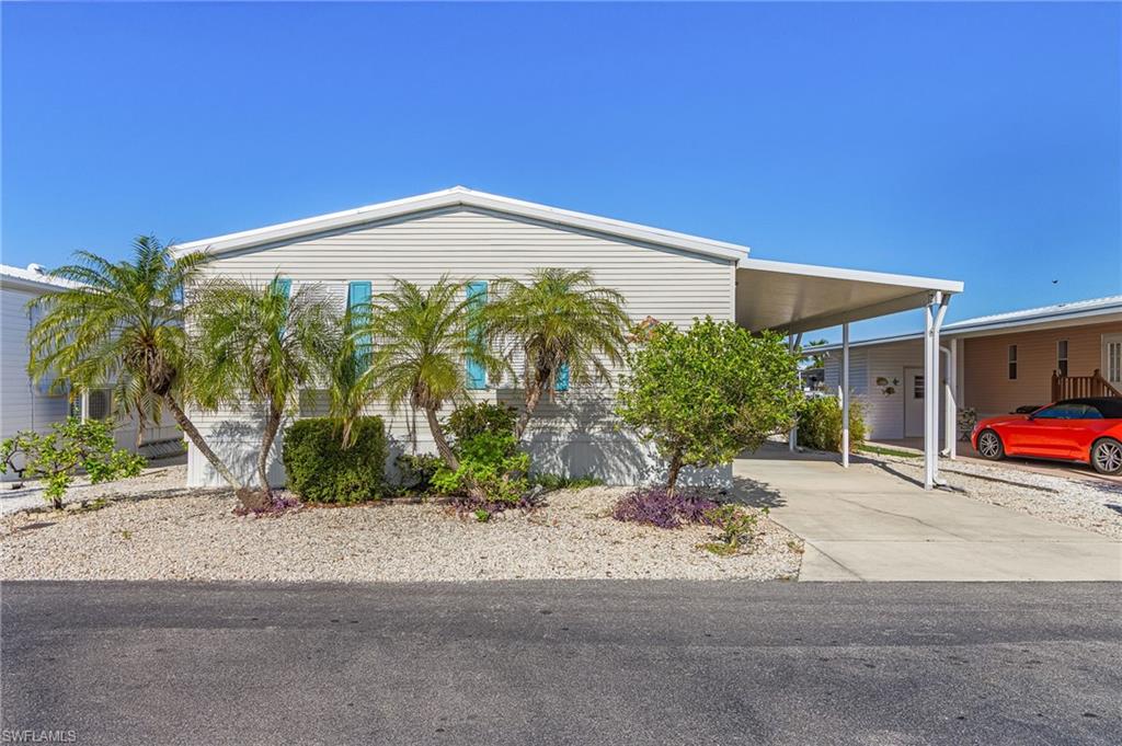 Spacious and well maintained, this home offers lots of storage.  It had no water in the house from any of the recent storms.  Home features a large great room, a glassed in porch on the water with a portable A/C unit, a small patio, a boat lift, an in home laundry room with sink and extra storage, and covered parking.  Come see this home to appreciate the spaciousness. Enjoy all St James City and the outer islands have to offer.  You can walk, boat, bike, or take your golf cart to all the bars and restaurants this community has to offer.  Great access to the outer islands, beaches, and fishing
