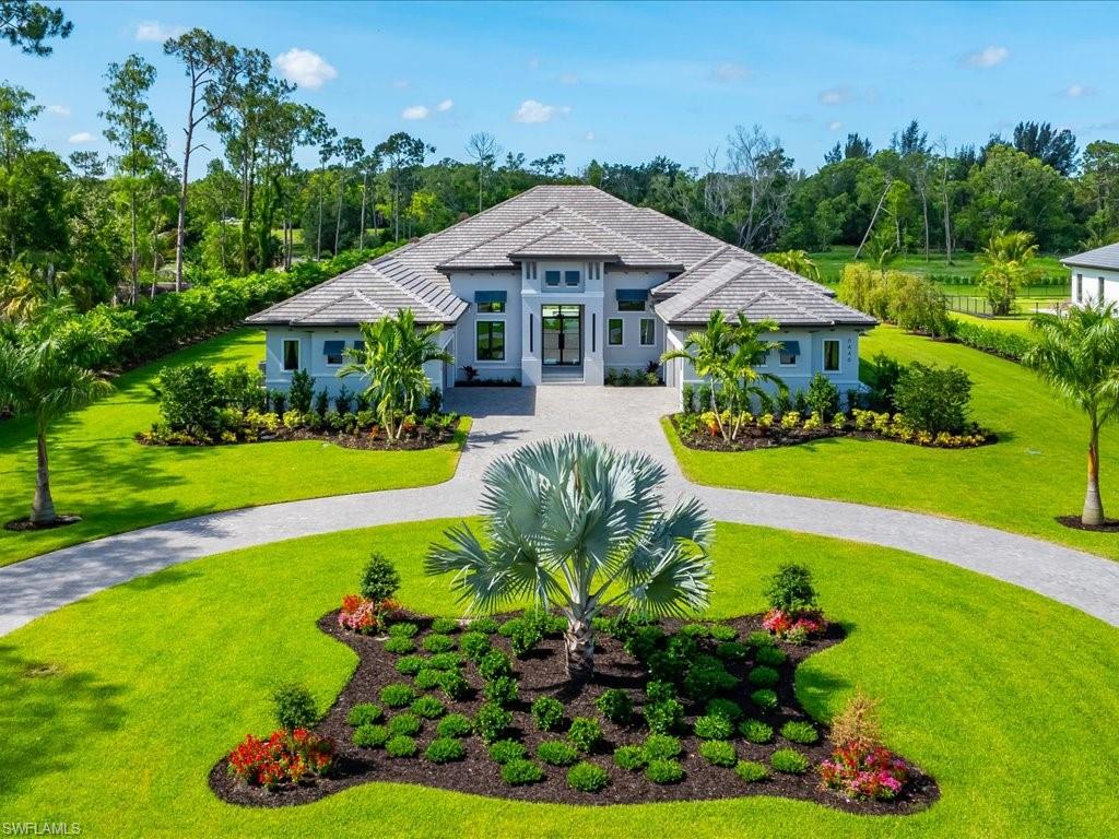 Commanding a rare blend of scale, privacy, and modern sophistication, 6446 Daniels Road is a newly completed luxury estate by Stock Custom Homes, ideally situated on two and a half acres of prized southern exposure in Livingston Woods. Encompassing nearly four thousand five hundred square feet under air, this residence is thoughtfully designed for both elevated entertaining and effortless daily living, offering four bedrooms, a private office, and an expansive four-car garage. A refined coastal aesthetic defines the interiors, with the home fully furnished by Clive Daniel Home to create a cohesive, turnkey experience. Soft, organic textures and curated finishes evoke a sense of understated elegance, while expansive living spaces flow seamlessly outdoors, inviting natural light to pour in throughout the day. The southern rear exposure presents an exceptional canvas for a future resort-style setting, with ample room to design a custom pool, guest house, sport court, or private garden retreat. At the center of the home, the kitchen is both visually striking and highly functional, designed to bring people together with ease. The primary suite offers a tranquil escape, complete with generous proportions and a spa-inspired bath that reflects the home’s serene coastal influence. The acreage itself sets this property apart, offering a sense of space and flexibility rarely found in Naples, with endless opportunities to expand and personalize the grounds. Located just minutes from the vibrant energy of Fifth Avenue South, Mercato, and Naples’ renowned white-sand beaches, this Livingston Woods estate delivers a compelling balance of privacy and proximity. A newly built offering of this caliber, with land and location in perfect harmony, represents an opportunity not easily replicated in today’s market.