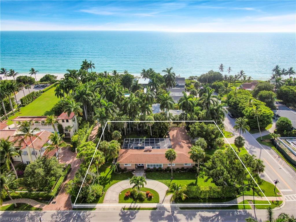 150 x 125 HUGE BEACH BLOCK LOT!!  .43 ACRE!  Live your dream life with the beach and 5th Avenue at your doorstep!! Build your ideal home on one of the largest lots south of 5th, with ample room for a 7,000 sf or much more home with expansive outdoor living including sun decks, fountains, fire pit gathering area, infinity pool, multiple garages, gardens, and all, just a few steps from the sunsets, sand and waves.  OR, if you are looking for something simpler, but almost on the beach, remake the current home into a 5 bedroom cottage in an iconic downtown location! Drawings in photos are merely suggestions to inspire your creativity (not architectural renderings). Watch the sun set from your balcony or take a few steps to the beach where Neapolitans gather at sundown. Then stroll one block to the famed 5th Avenue, where the evening of fun and fare await.  Shop, dine in one of your favorite restaurants, or stop to listen to the street side musicians. The home is rented most of the time, with returning rental income should you so choose. This is Coastal Living at its best!!  With the size of this lot and the proximity to the beach, this is an opportunity you will regret missing.