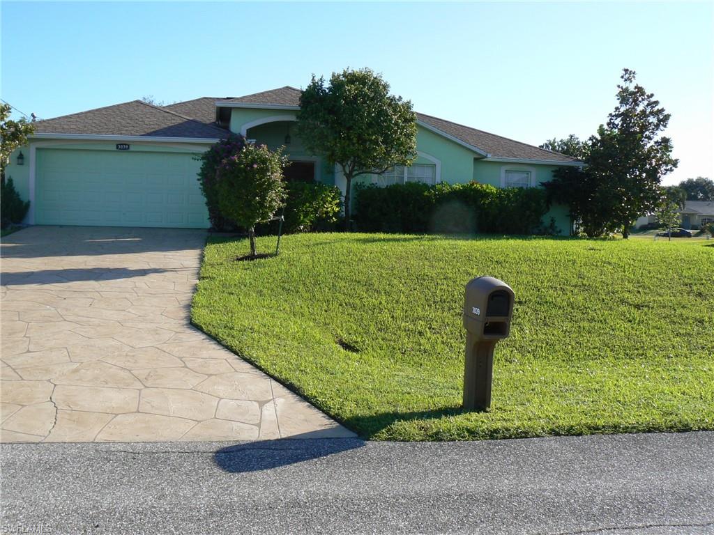 BEAUTIFUL 3 bed/2 full bath Florida home with UPDATED EVERYTHING! Red double-door front entry compliments the newly-painted green exterior. Professionally landscaped, NEW laminate hardwood flooring throughout. Decorative concrete overlay on driveway, walkway, front entrance, and patio. Exotic litchi nut, mango, bananas, cattley guava, and star fruit trees. LG Stainless steel appliances with Whirlpool washer and dryer front loaders on pedestals. NEW matching granite countertops in bathrooms and kitchen with NEW sinks. UPDATED, decorative ceiling fans. NEW AC System and ductwork with transferable 13 years of parts and labor warranty. New irrigation system and box. New water heater and garage door opener. New well-pump. NO FLOOD ZONE/NO FLOOD INSURANCE REQUIRED. Newly-screened patio. Spacious closets. Don't miss out on this unique home with its own Florida vibe!