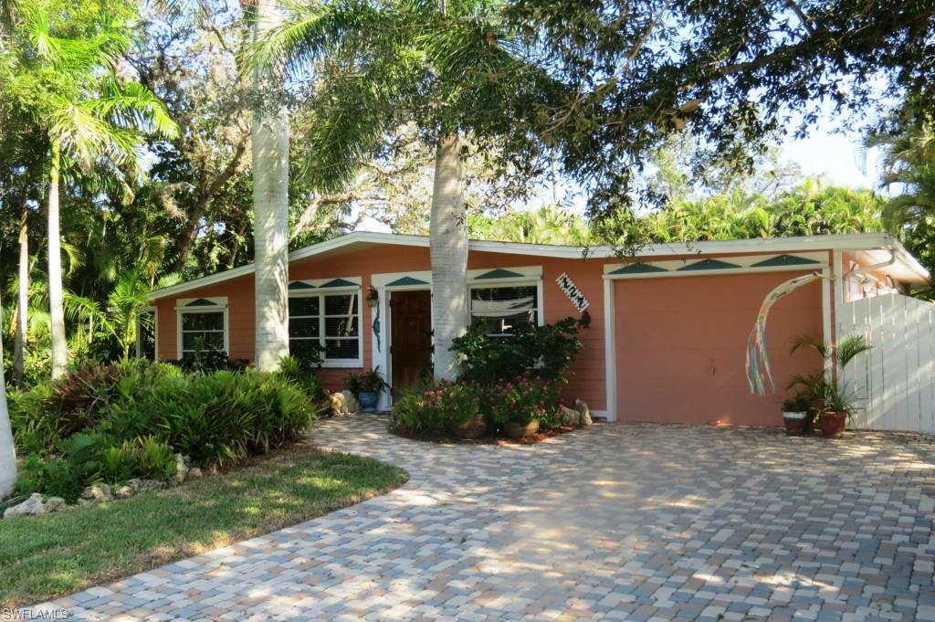 Cute, Cute and Cute! Immaculate inside and out. Beautiful granite kitchen with newer appliances and top of the line cabinetry offering you tons of storage. This home has been completely upgraded with travertine marble floors, white bead board ceiling in great room, custom paint and a large steam shower in the master bathroom. This bright open great room floor plan opens to a tropical lushly landscaped, fully fenced private backyard featuring an outdoor shower, huge brick pavered entertainment area and wooden deck for tanning or relaxing in the warm sunshine. A must see property. Located in Collier County and offering you deeded boat ramp membership for only $75 per year. You can launch your boat just one block away at the boat ramp located on 3rd Street. The boat ramp provides you direct gulf access just a short  minute ride to Wiggins Pass. Walk or Bike to Barefoot beach and over 10 restaurants in the surrounding area! Cut and pate the following link for the interactive floor plan. http://www.homesight.net/rss/tours/index.php?id=30554