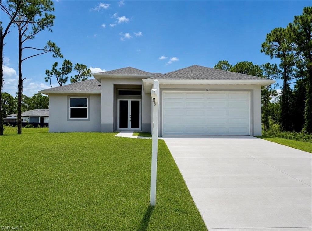 Brand new home, ready to move in. C.O. has been issued and is attached to the listing in MLS. Affordable 3 bedroom 2 bath, high ceilings throughout with tray ceilings in the living room, dining area and primary bedroom, open floor plan with large porcelain tile floors throughout the entire home with 5 inch baseboards, spacious kitchen with QUARTZ breakfast bar and countertops, stainless steel appliances, impact resistant windows and doors for energy efficiency and safety, sliding doors lead to the covered patio in the rear with tile floors as well overlooking the spacious backyard, 90 X 125 lot, designer LED light fixtures, primary bedroom with tray ceiling, dual walk in closets, private ensuite bath with dual sinks, large tiled shower enclosed with frameless glass, nicely tiled tub and shower in the guest bedroom area as well, indoor laundry room with stainless steel sink/laundry tub, transom glass over the front door for extra natural light, seal coated floor in the garage for easy maintenance, excellent quiet neighborhood atmosphere located within walking distance to stores, just minutes to SR 82, I-75, FT Myers and the SWFL International airport. NO FLOOD INSURANCE REQUIRED. LEHIGH IS THE HIGHEST ELEVATION IN LEE COUNTY.