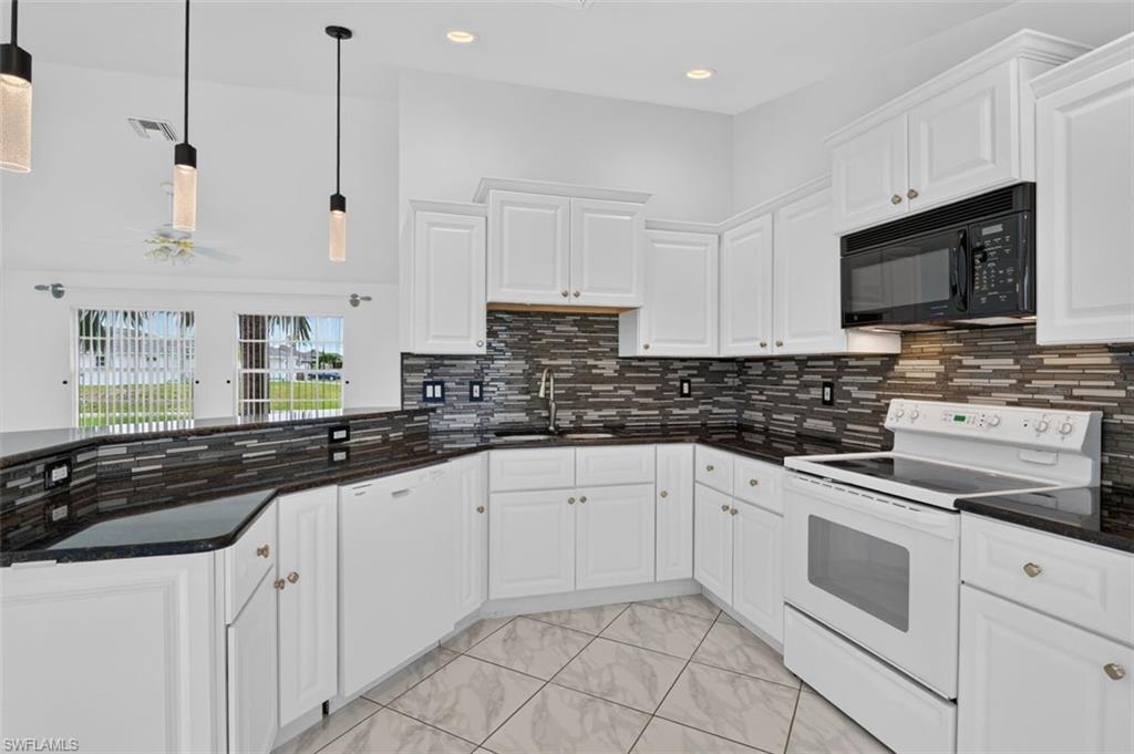 This beautifully maintained 3 bedroom, 2 bathroom home blends comfort, efficiency, and modern style in a layout designed for easy living. The open concept main living area is enhanced by cathedral ceilings and abundant natural light, creating a bright, airy atmosphere from the moment you walk in. A split floor plan ensures privacy, with the primary suite thoughtfully separated from the guest bedrooms.

At the heart of the home, the updated kitchen stands out with its clean, modern aesthetic. White cabinetry keeps the space bright and timeless, while the black countertops add a bold, sophisticated contrast. An eye-catching backsplash ties the whole look together, adding texture and personality that elevates the room. Whether you're prepping meals or entertaining guests, this kitchen feels both stylish and functional, flowing effortlessly into the surrounding living and dining areas.

The updated bathrooms continue the home’s contemporary feel with pleasing finishes and thoughtful design.

Additional upgrades include a whole-home Westinghouse 9500-watt dual-fuel generator, GenerLink connection, fuel tank storage, and an air conditioning soft start system that improves efficiency and reduces energy strain. The 2-car garage offers ample storage and parking, while an electric-equipped shed with workbenches and shelving provides an excellent space for tools, hobbies, or extra storage— a true bonus for DIY enthusiasts.

With the home NOT in a flood zone, you’ll worry less and save more (money). The property is already connected to central water and sewer, eliminating the maintenance, inspections, and long-term costs associated with well and septic systems — a valuable benefit that provides reliability and peace of mind. 2018 Roof. 2018 A/C. 2021 Water Heater. Washer, Dryer, and more included!

Move-in ready and thoughtfully upgraded, this home offers the perfect blend of style, comfort, and reliability. Buyers and Realtors, schedule your showing today!