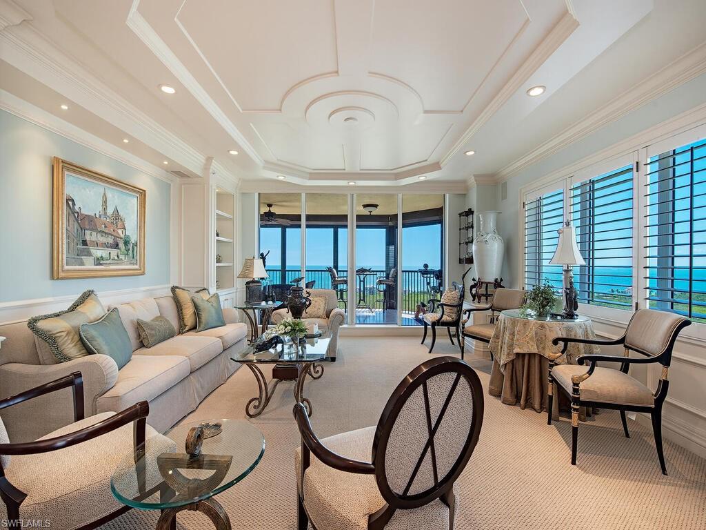 Enjoy the elegance of this spacious, 21st floor, 2555 sq. ft., 2 bedrooms plus den, turnkey furnished home. Every room is enhanced with classically appointed detail from floor to ceiling. Enjoy the panoramic views of the Gulf of Mexico, Pelican Bay and beyond, rapt with the sounds of songbirds and gentle warm breezes from two large sunrise and sunset terraces.  Or simply immerse yourself in the nature that is on your doorstep by walking the berm and the meandering wooden walkway lined with mangroves and scenic waterways that end at Pelican Bay’s magnificent white sand beaches and private clubhouse with outdoor dining. Situated within The Marbella, a luxury high rise with wonderful neighbors and genuinely helpful staff, the amenities are second to none with concierge, dining including room service and care services right at your fingertips.
